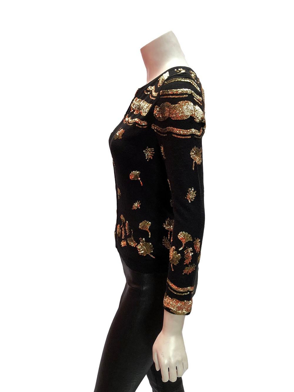 Prabal Gurung Black and Gold Sequin Dandelion Flower Cardigan

Black cashmere cardigan with gold sequins in a floral dandelion design by Prabal Gurung. Gold bar buttons. So incredibly soft. Size small. 