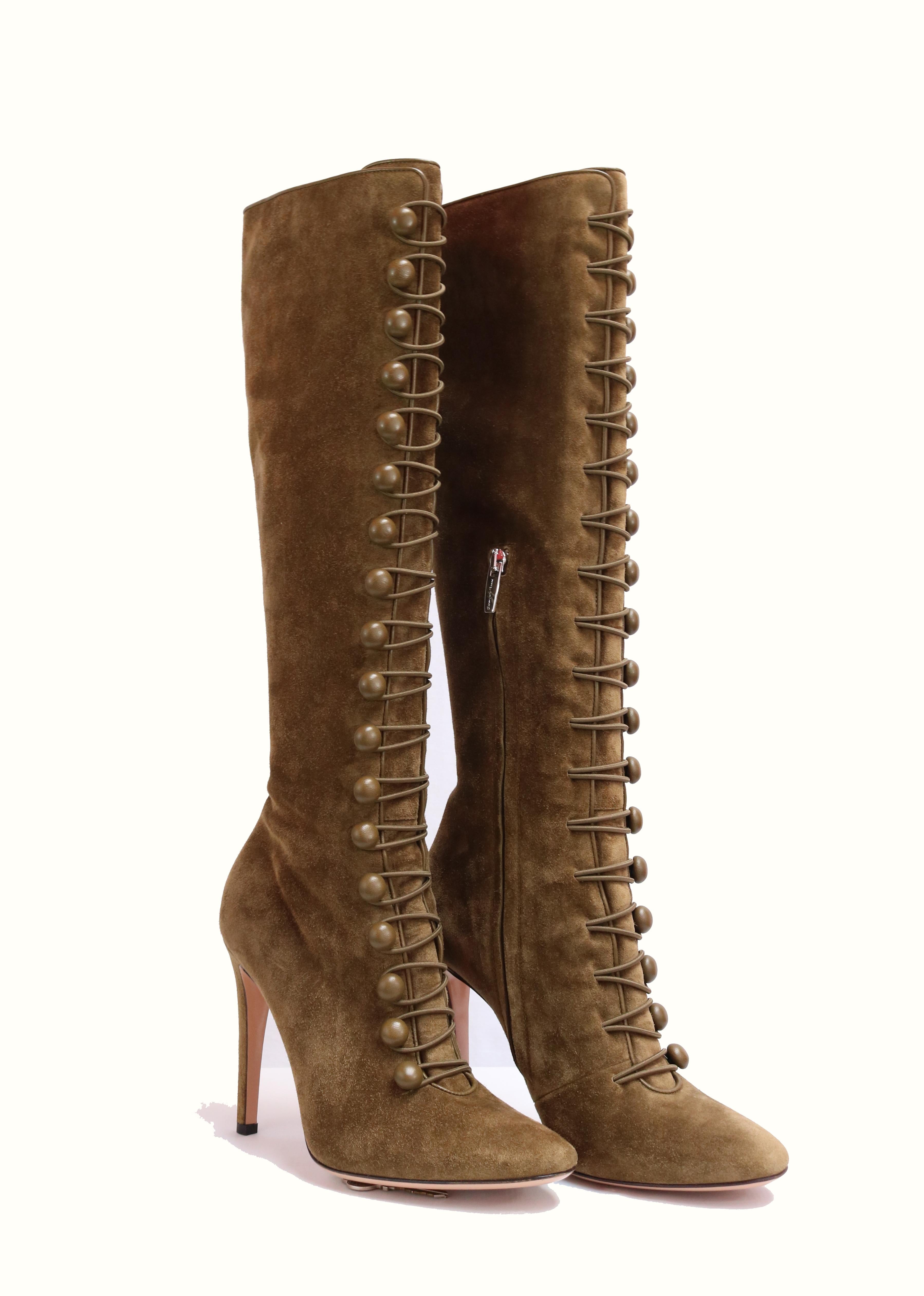 Marais Suede Knee-High Boot with Rouleau button straps define military-inpired boot. 
-Self-covered heel, 4.13