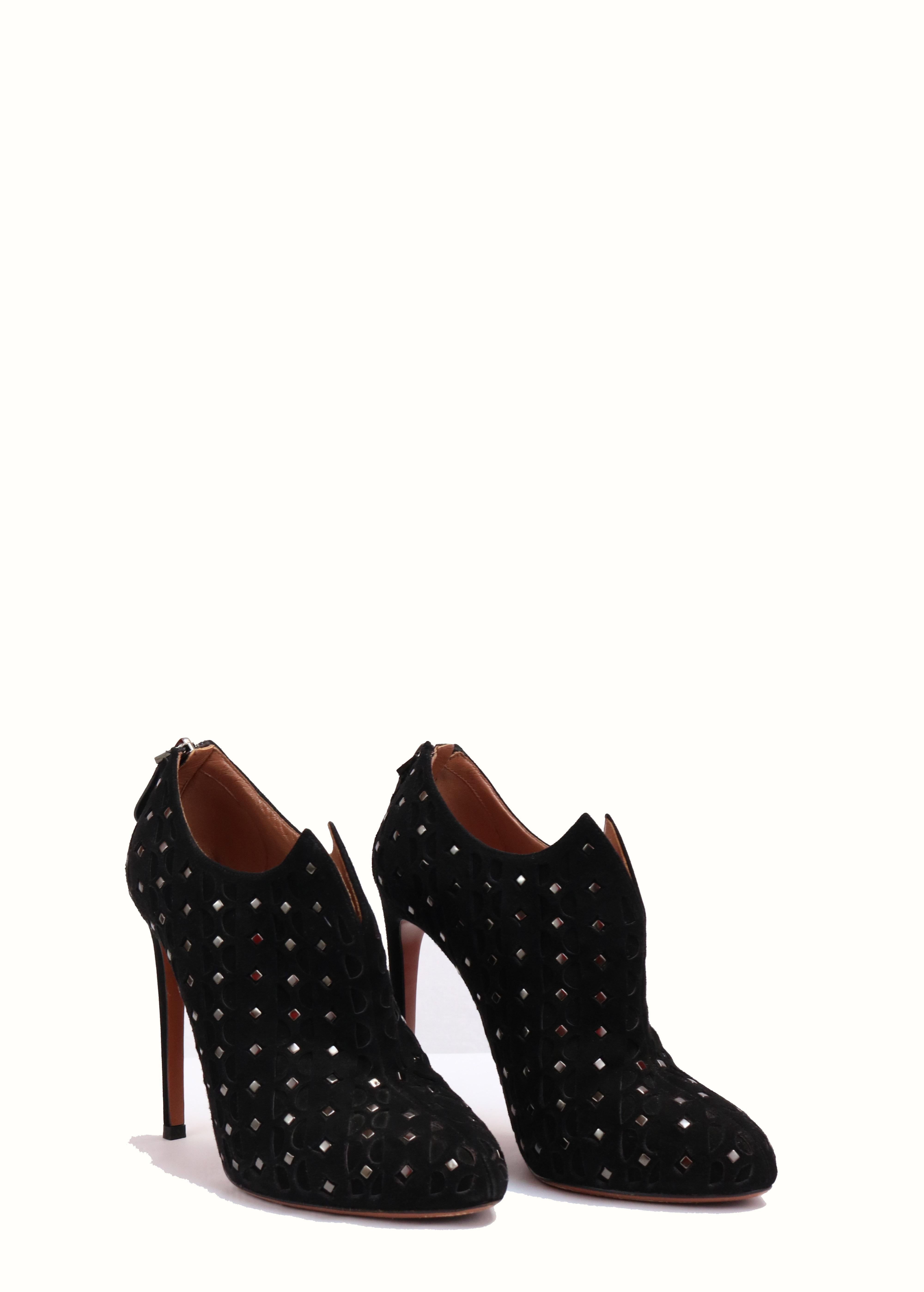 -Black suede booties with intricate studded and lacer cut design.
-Heel 4.5 -5