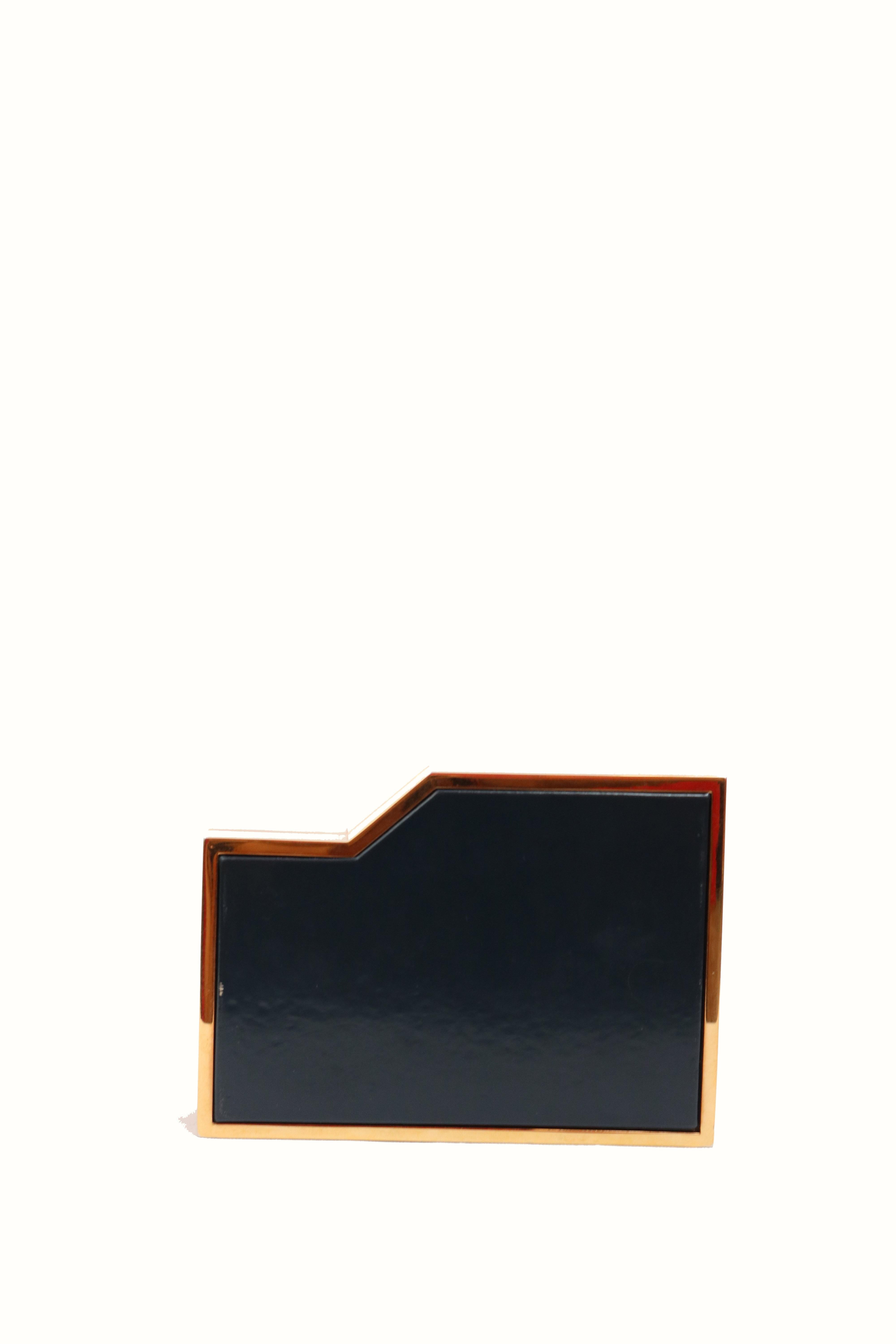 -Geometric gold, pink and navy clutch 
-Front face is pink in ponyhair leather 
-Back is navy leather 
-Gold-tone hardware
-Light gray inside leather 
-Signs of worn, please see photos. 
