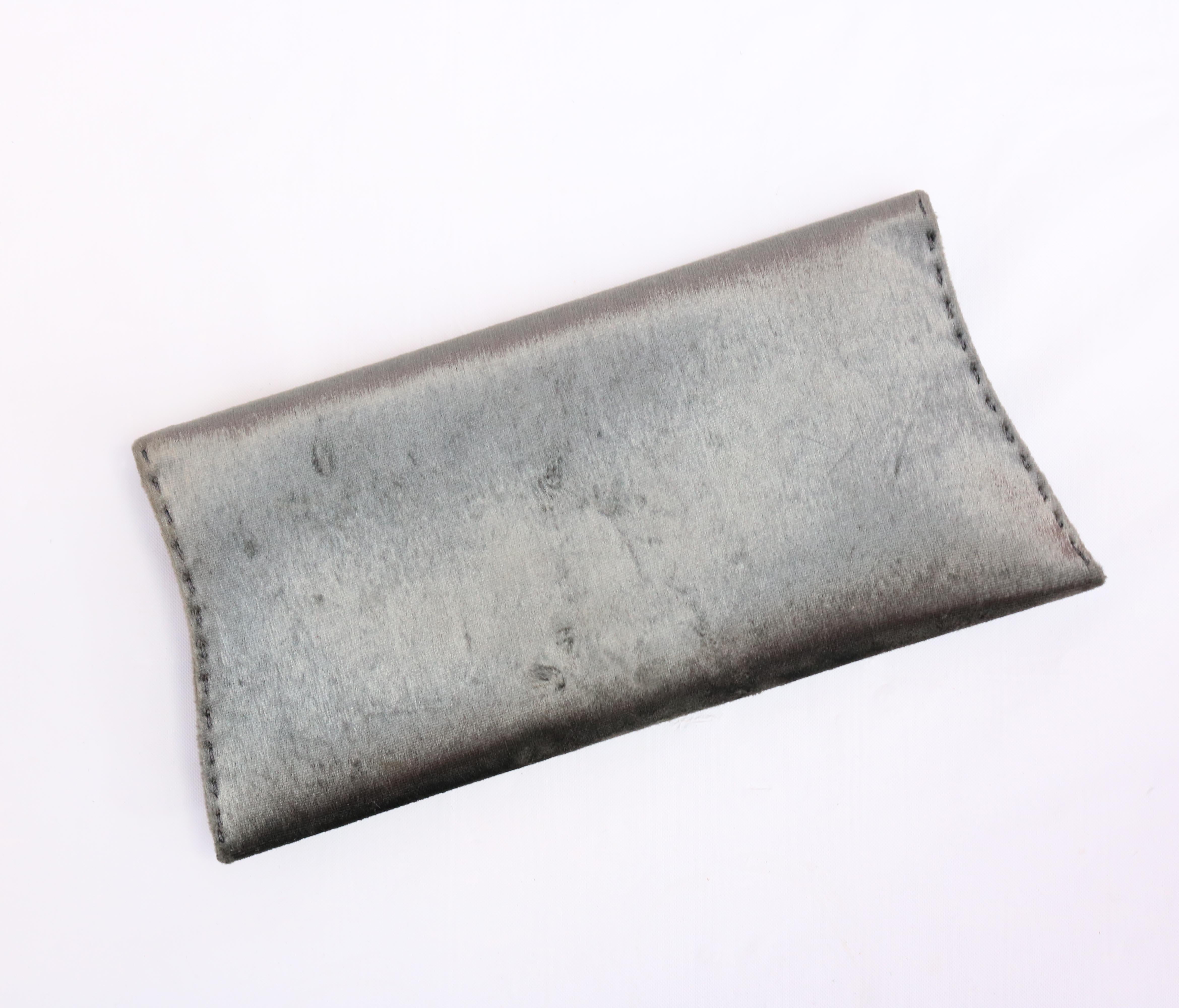 VBH Manila Stretch Silver Clutch 
Mint Condition. 
Suede Interior with no signs of wear. 

V.B.H. is an Italian luxury accessories house, the core of which is a line of men's and women's luxury leather bags along with a collection of fine jewelry