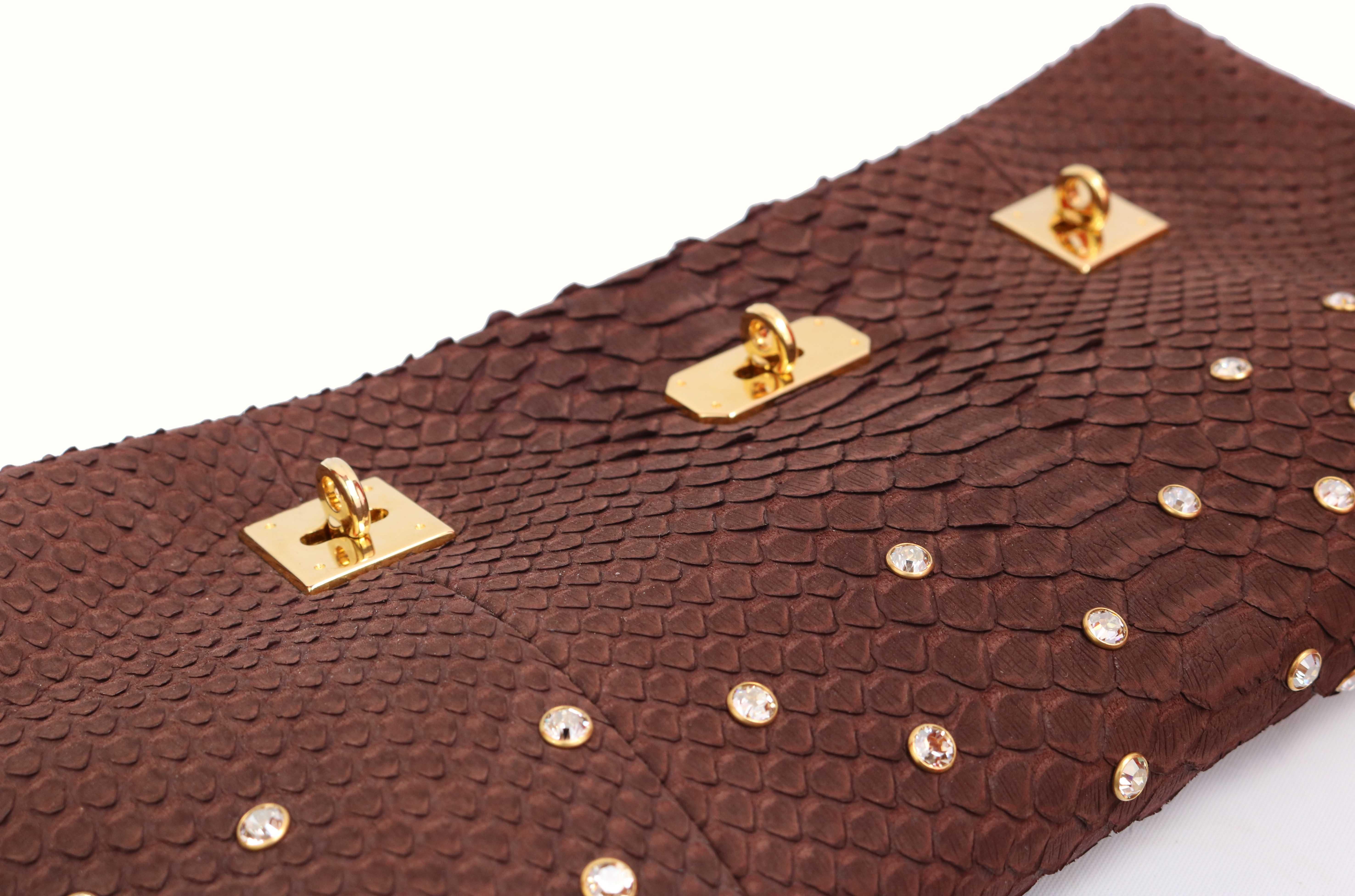 V.B.H. Brown Python Clutch with dust bag in pristine condition. 

V.B.H. is an Italian luxury accessories house, the core of which is a line of men's and women's luxury leather bags along with a collection of fine jewelry and decorative home