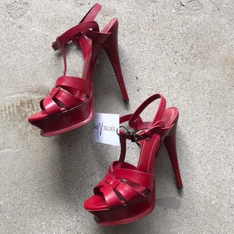 Authentic YSL Tribute 105 deep red platform heels. Comes with dustbag. Overall, in very good, preowned condition. Minor signs of natural wear on soles and fading to the red on the leather on the back of one of the heels. Size 7. 