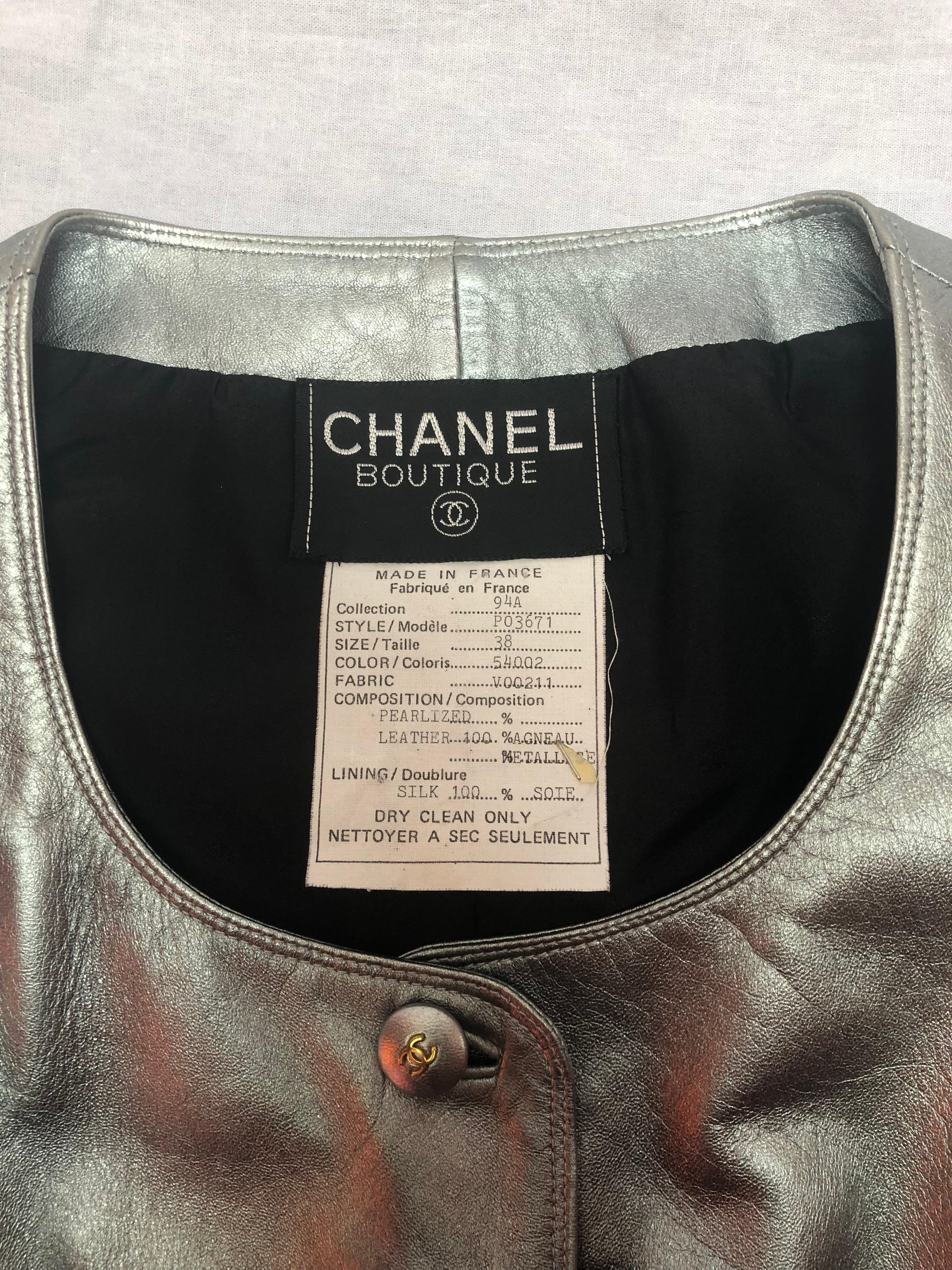 Chanel Vintage Vest. Silver, leather and silk lined with two front pockets. 
From 1994 Chanel collection. 
Size 38
Made in France
100% Lambskin leather 
Lining: 100% Silk
Leather covered buttons with gold tone CC logos
2 Front slip pockets 
16.25