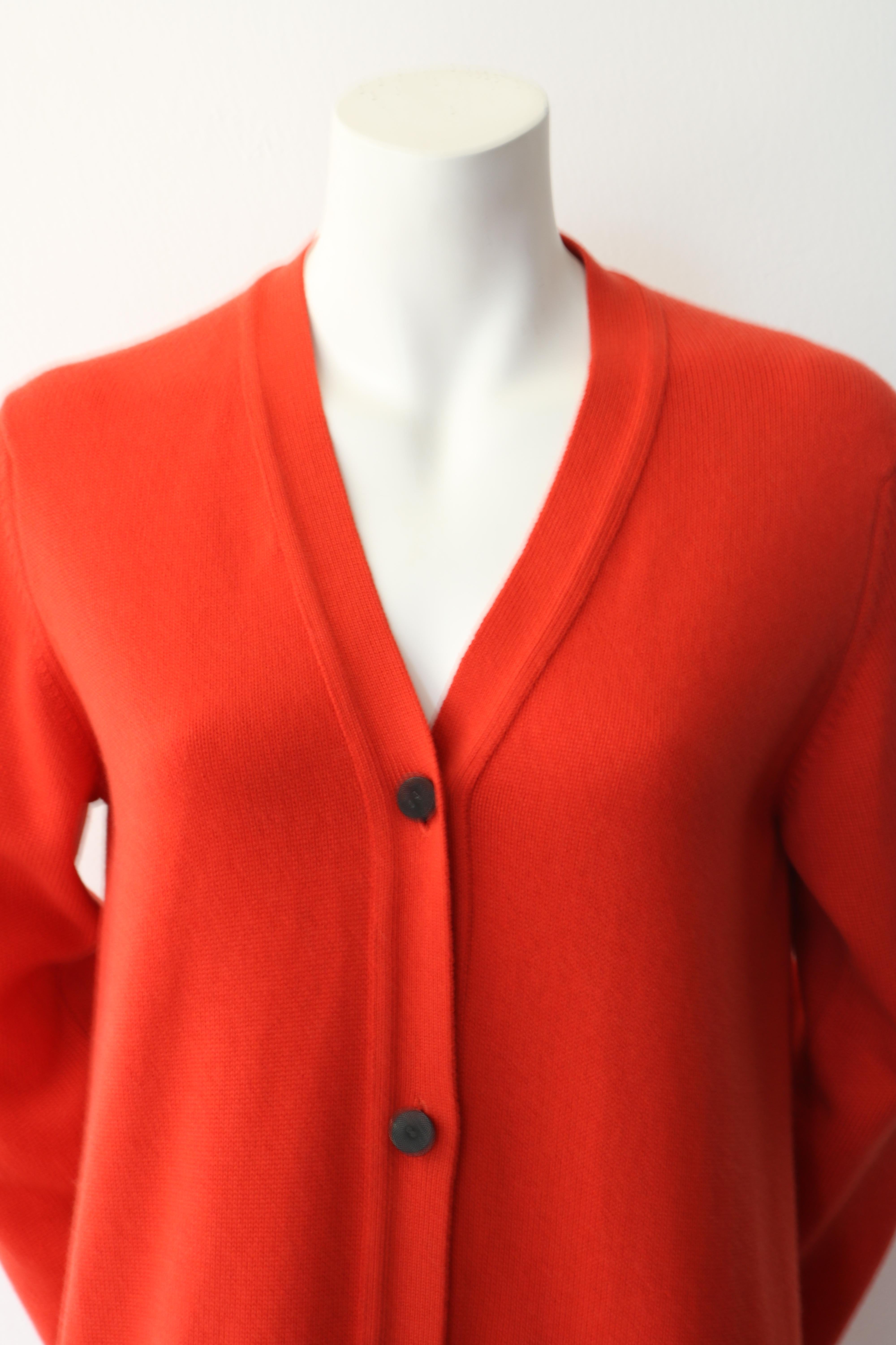 Beautiful Brand new orange Hermes cardigan. 
-Size 40 
-100% Cashmere 
-Pockets in the front 
-Tags Still attached
- Retailed for over $3500
- Mint Condition