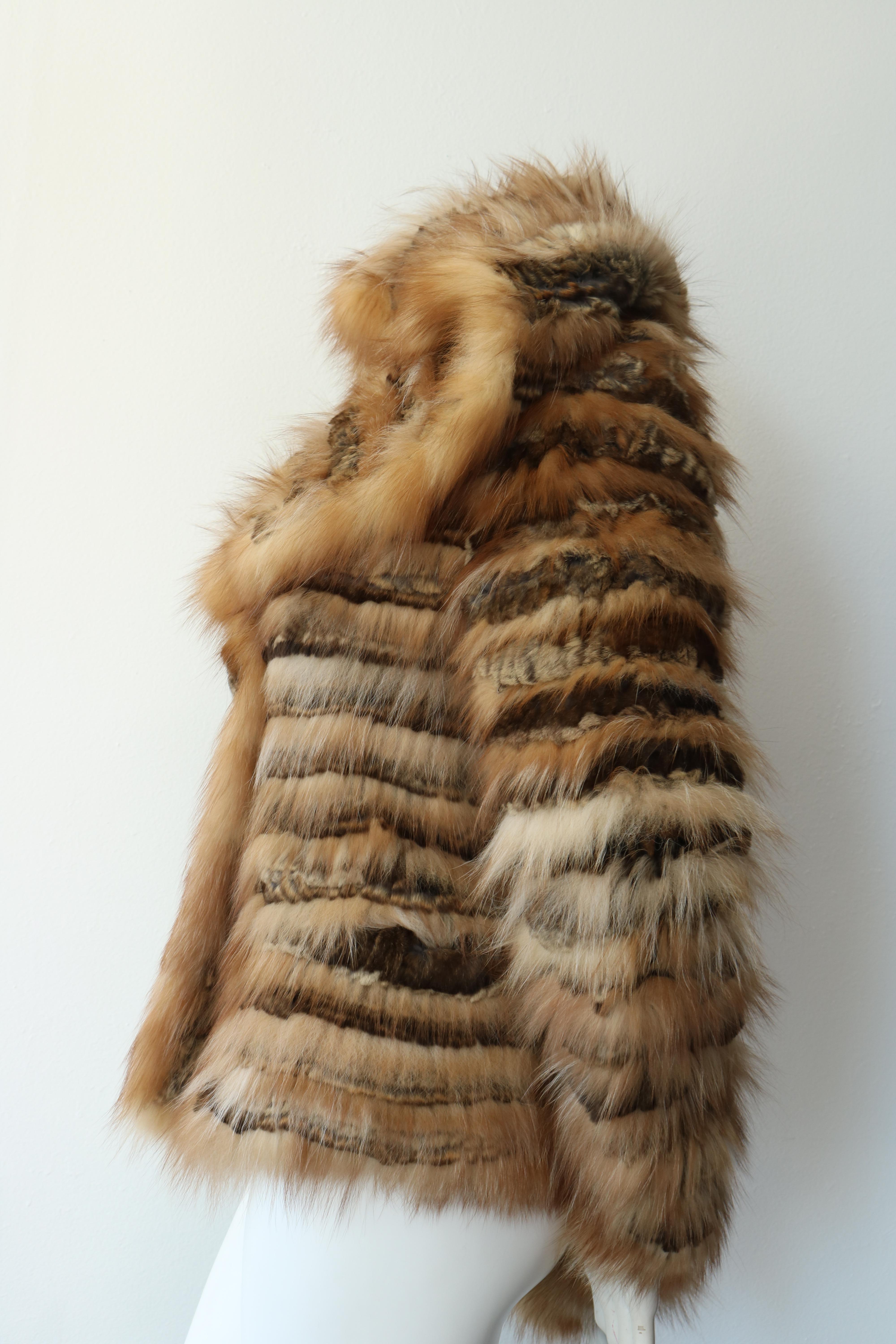 Beautiful Rizal Vintage Fur Jacket with hood. 
Assorted brown colors with white mixed in. 
Never Worn Tags Attached 
Retail $3785
Size: M 
70% Rex Rabbit 
30% Fox
