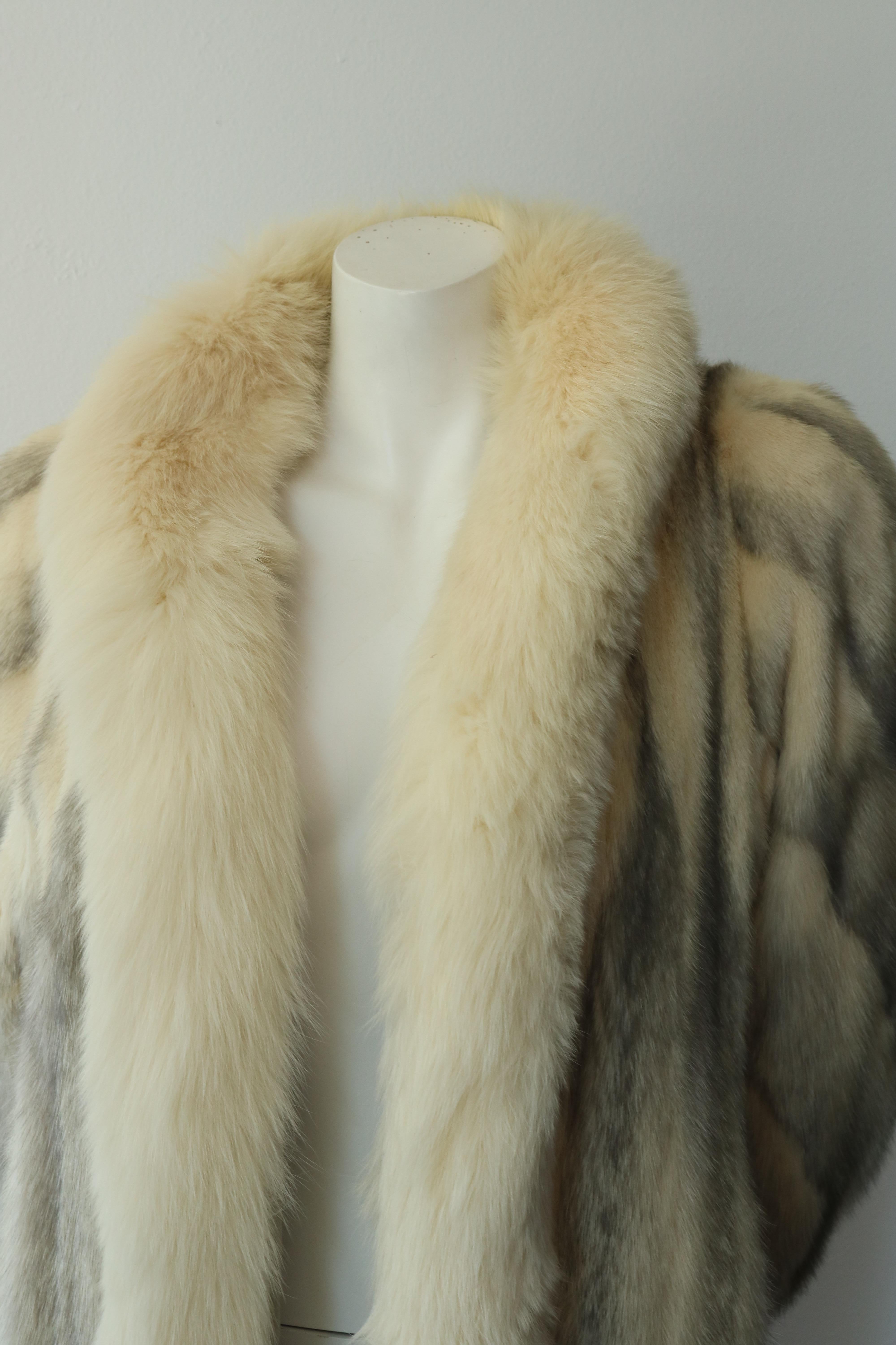 -Gorgeous, full length, vintage Christian Dior Fur Coat 
-White and Grey in color 
-Embroidered in the inside with previous owner's name
-circa 1980s
-Some minor imperfections on the inside lining, but overall amazing condition and a one of kind