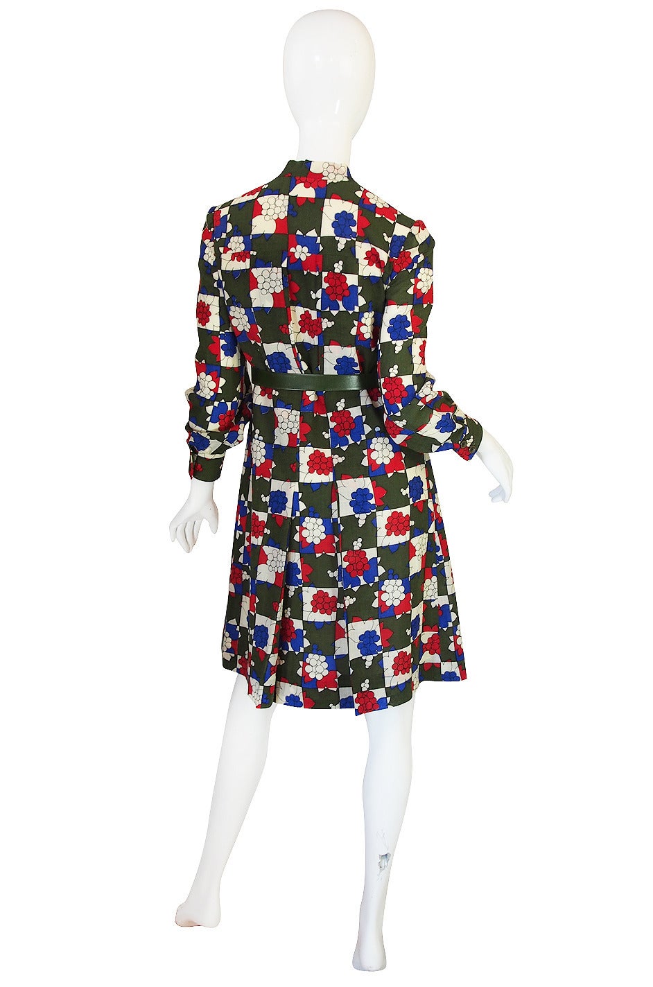 I love both the chic little lines of this dress, in person you get a better sense of the subtle pleat work that runs down the front, and that amazing print. It is Miss Dior and is constructed to extremely high standards - all hand finished and