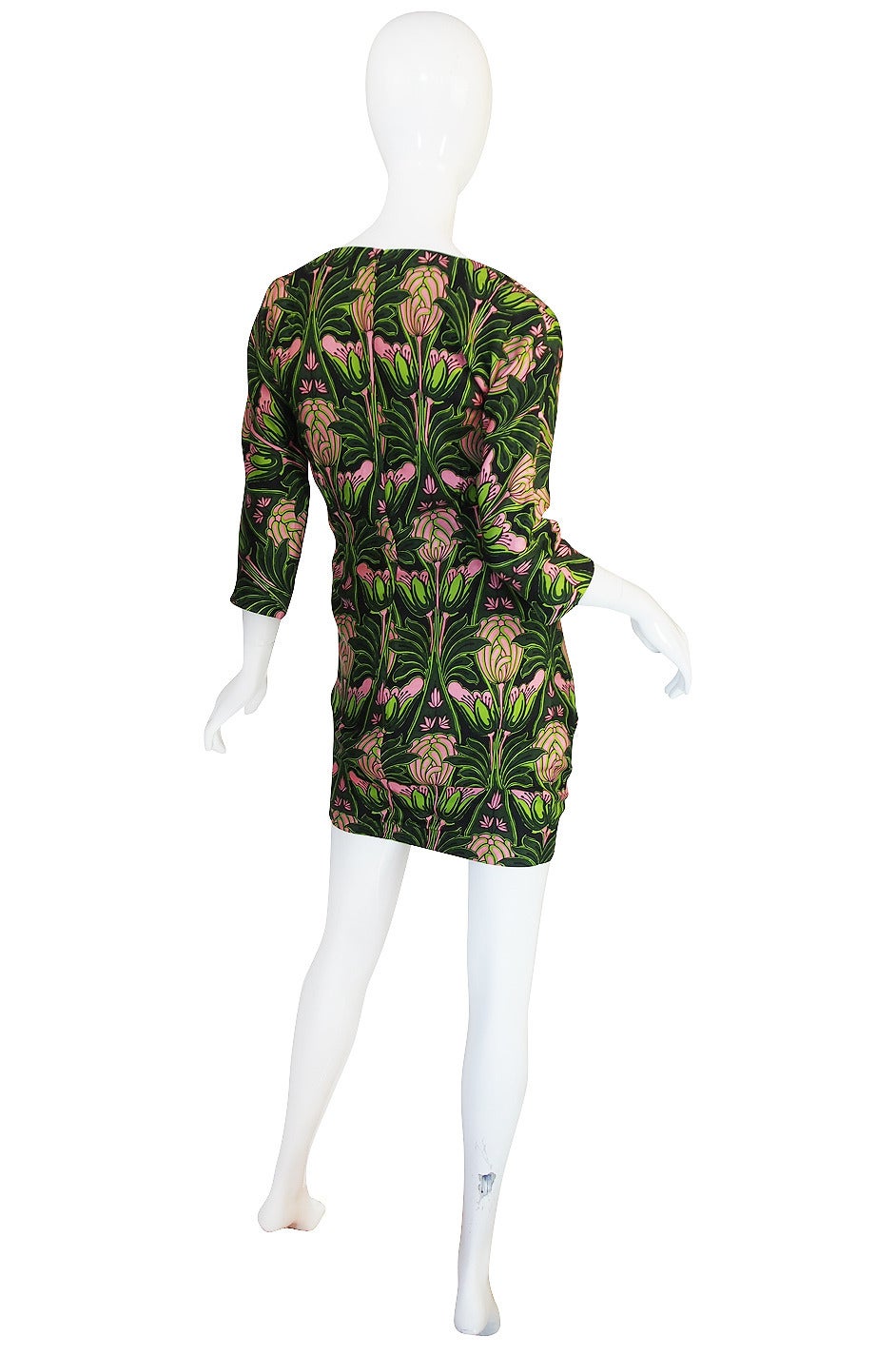 For the Prada collector this dress will be instantly recognizable. From the runway of the F/W 2003 collection is that fabulous little dress done in a floral silk whose print was reissued from the 1960 Holliday & Brown archives. Holliday & Brown was