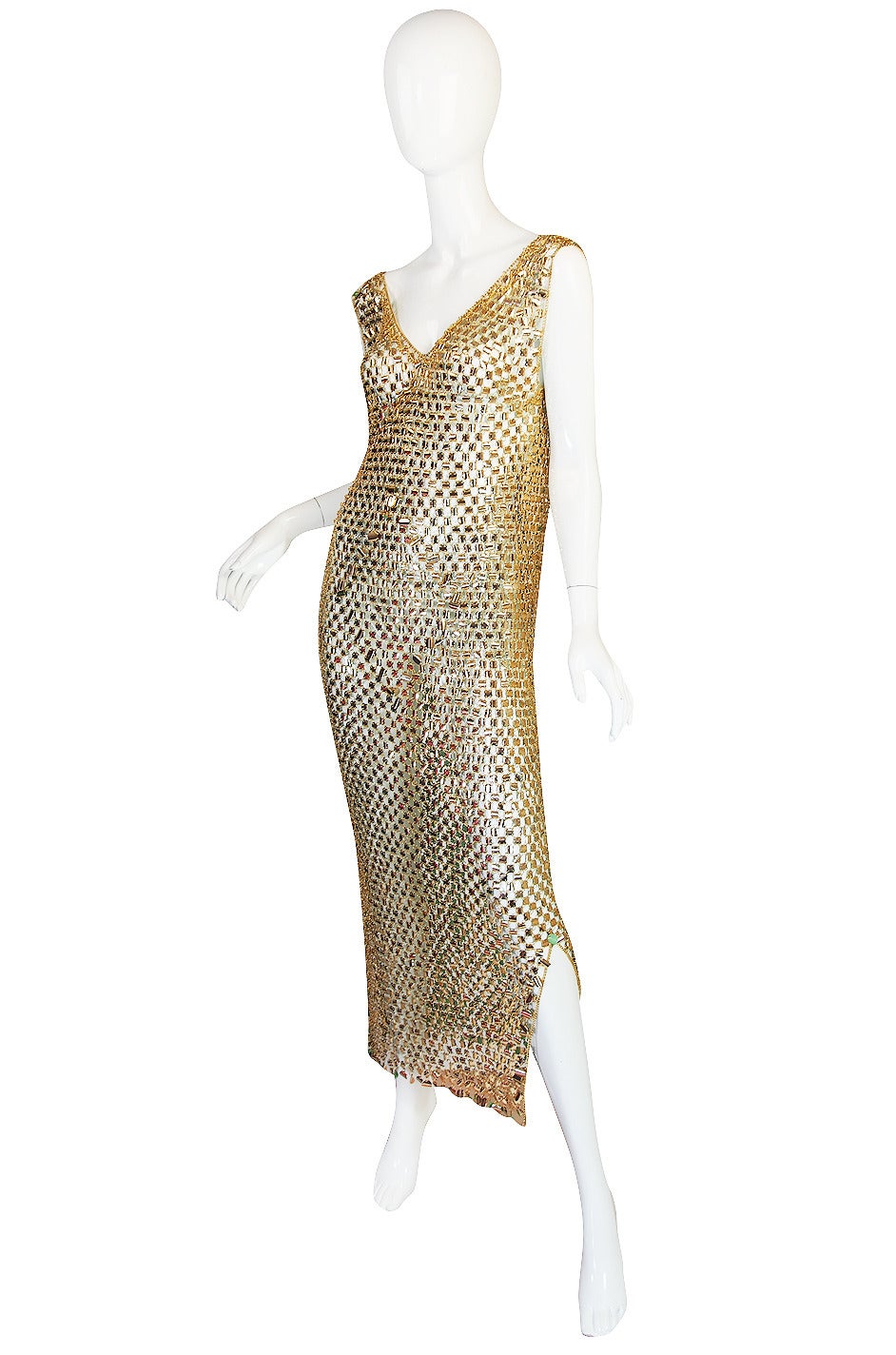 Early Rabanne pieces are so rare to find and I have three spectacular example of his work in the shop today. This one is a stunning plasticized aluminum chain mail dress in gold with the signature green backing that this particular range of dresses