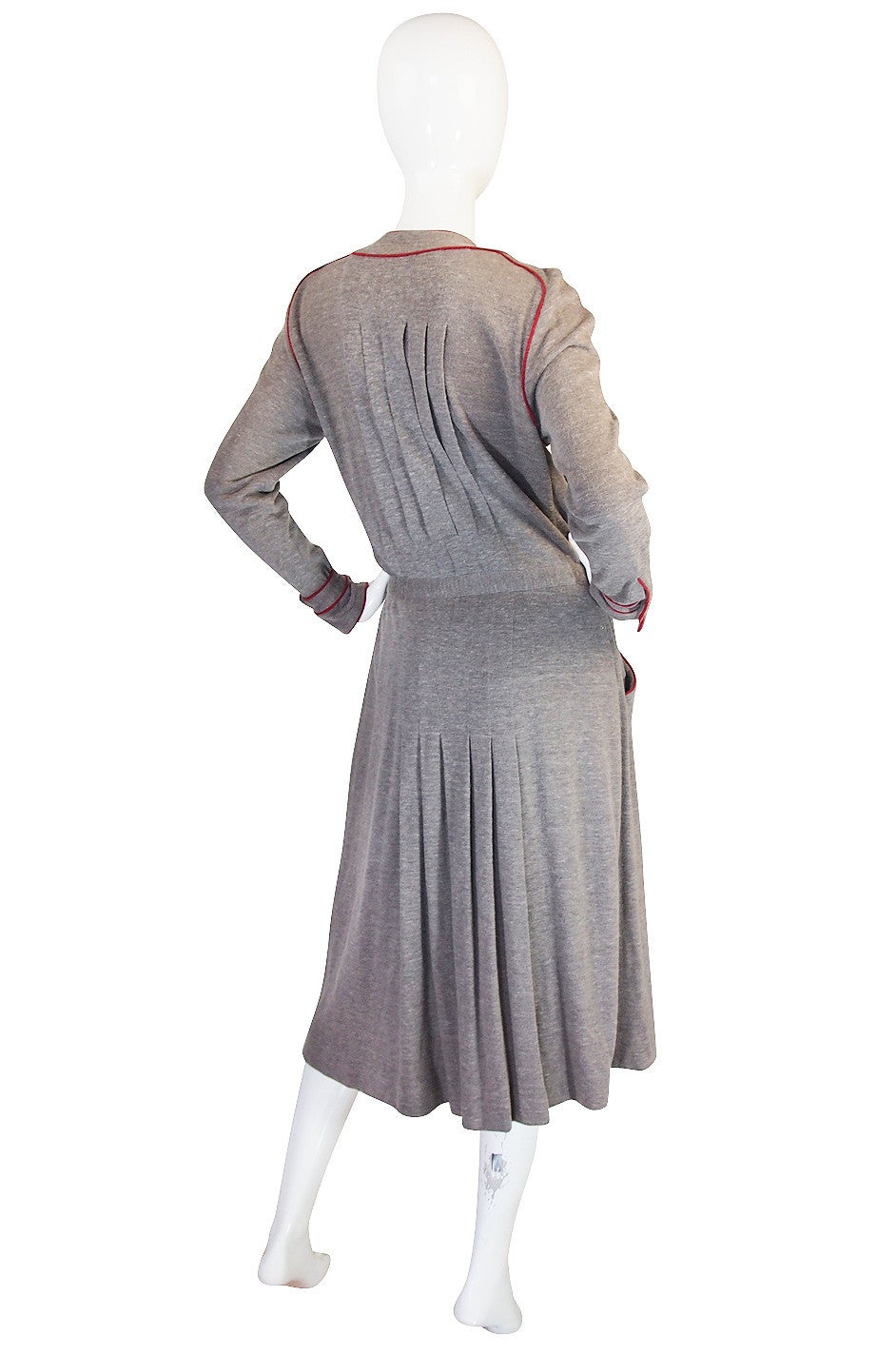 This is the kind of dress that Chanel excels at with its understated elegance and beautiful lines. The fabric is a soft grey and has an almost subtle angora feel to it but it is actually a combination of wool and silk thread and I imagine it is a