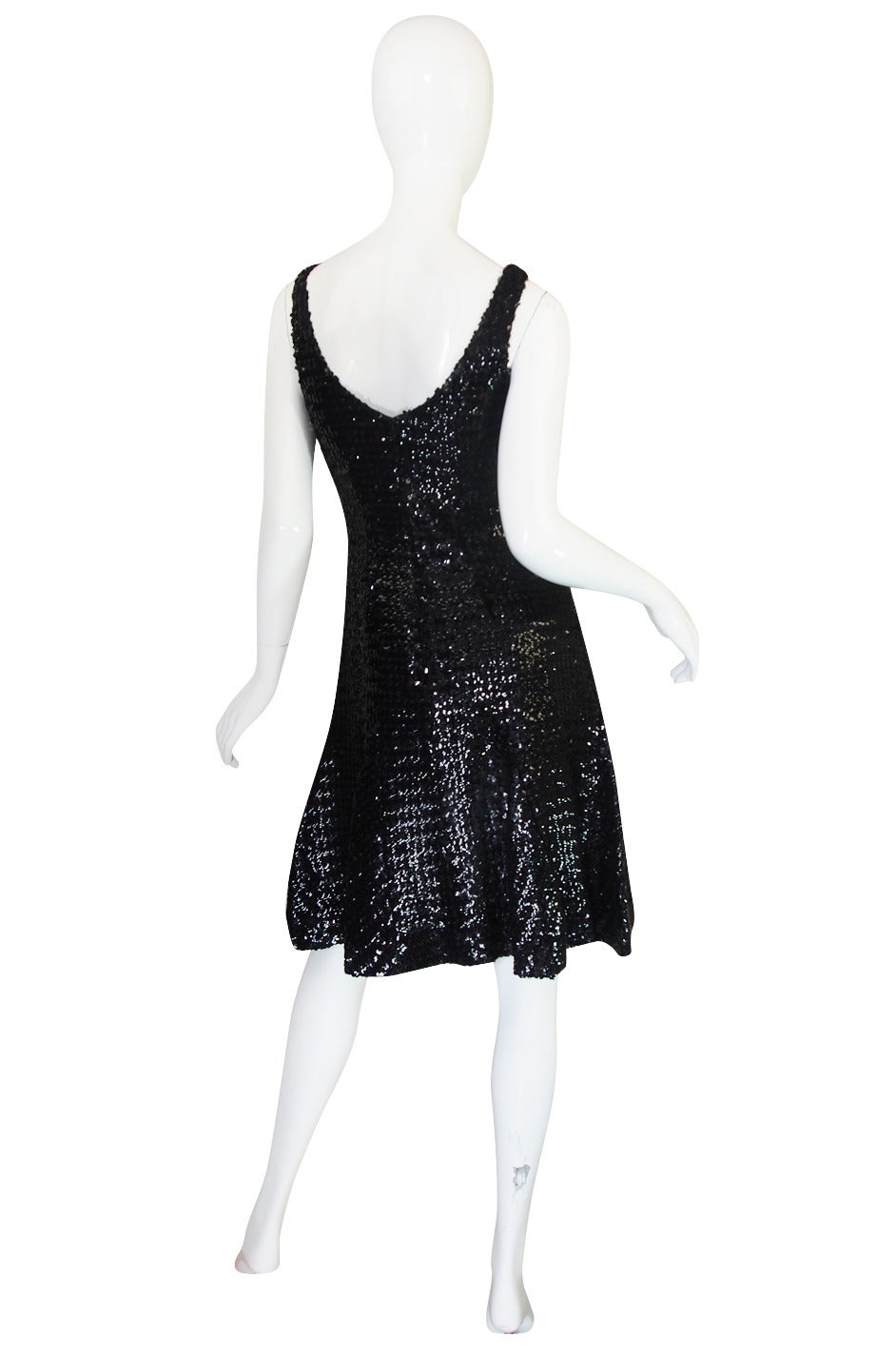 A very fine and fabulous sequin wiggle dress by Donald Brooks that I just adore. If you love it in the photos you will love it even more when you actually get to see the level of construction and work that would have been done to so densely hand