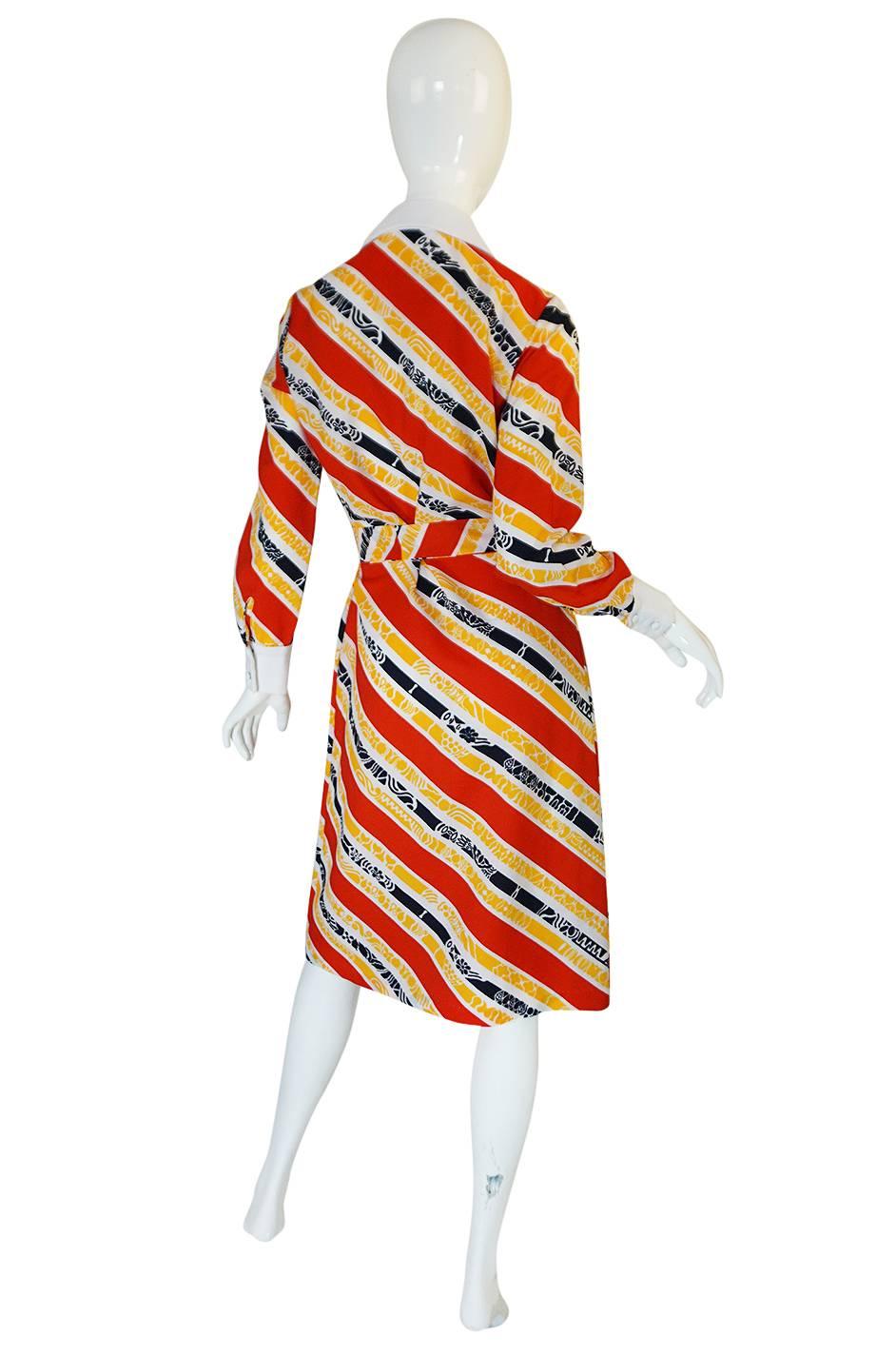 If you need a bold, statement making, sort of crazy dress - you just found it. This is one of those fabulous 1970s shirt dress pieces that Lanvin excelled at in the early part of the decade. This one is especially bright and happy feeling. It is