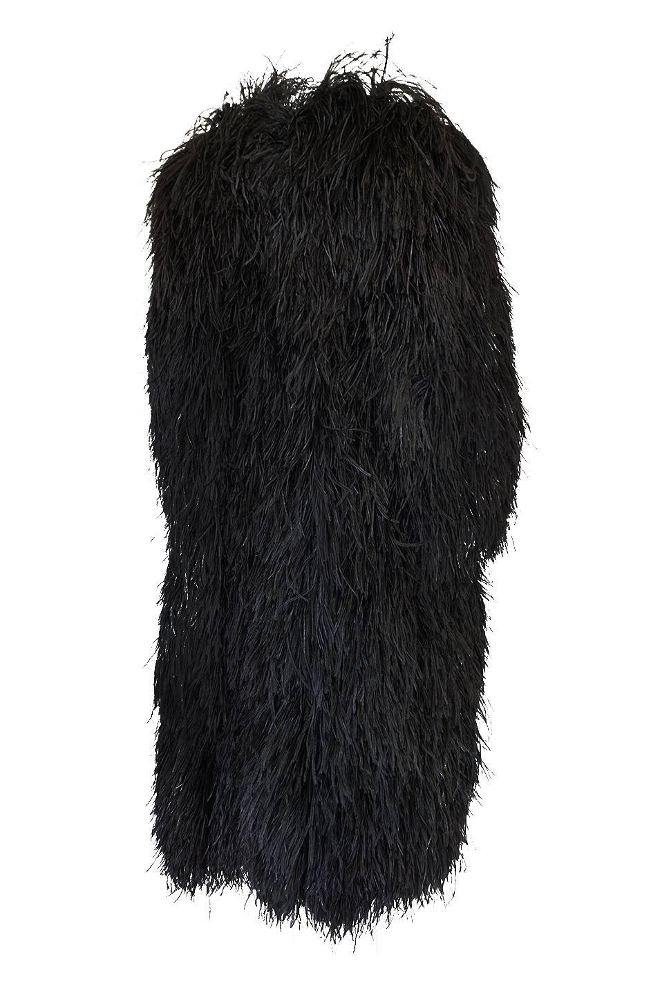 Yves Saint Laurent feather coats are rare but the ones that are made from the ostrich feathers rather then the more typically seen down feather ones are the holy grail. This one, in black, in especially wonderful and a very rare find. A similar