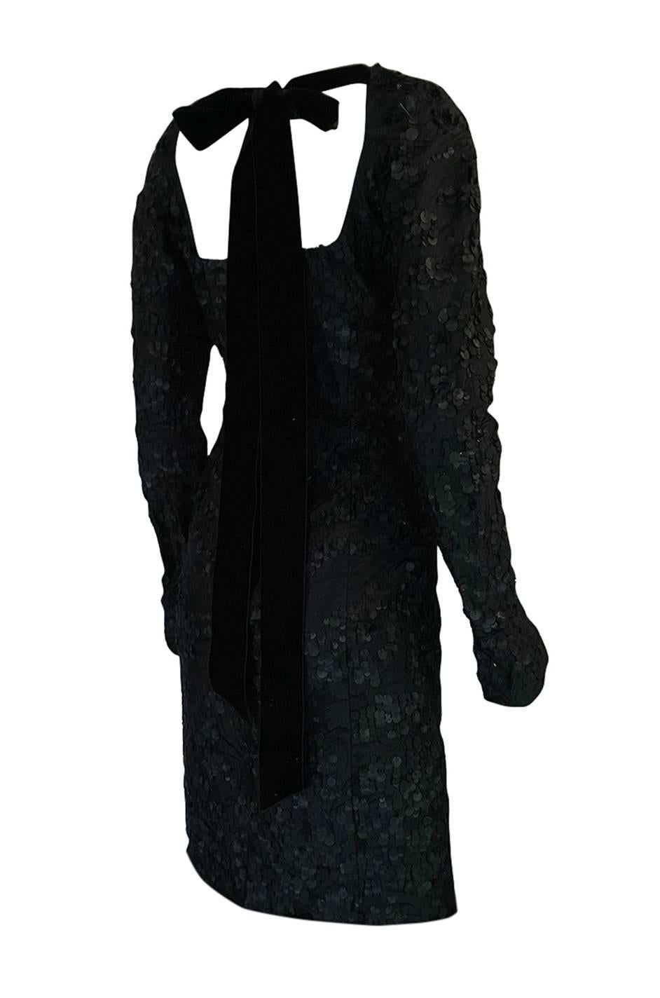 This is a more intricate version of dress Look 32 as seen on the Fall 2002 Tom Ford for Yves Saint Laurent runway. The Vogue review of that collection stated in part: 