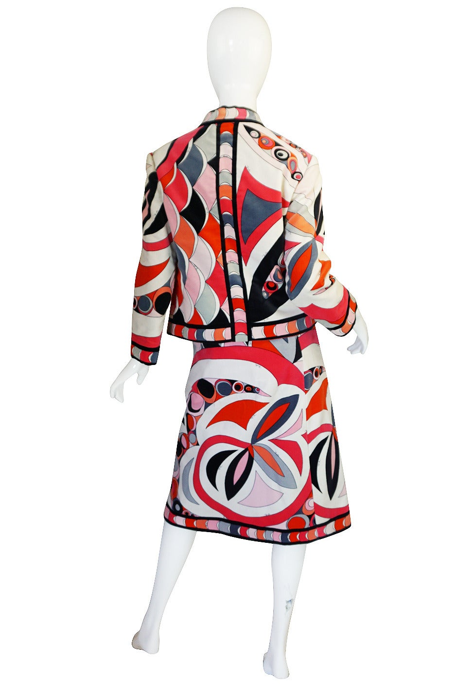 This set is just absolutely gorgeous and in person the colors are even more fabulous then how they have photoed. It really pops and you just feel happy just looking at it. It is an early 1960s printed Emilio Pucci skirt set that is made of his