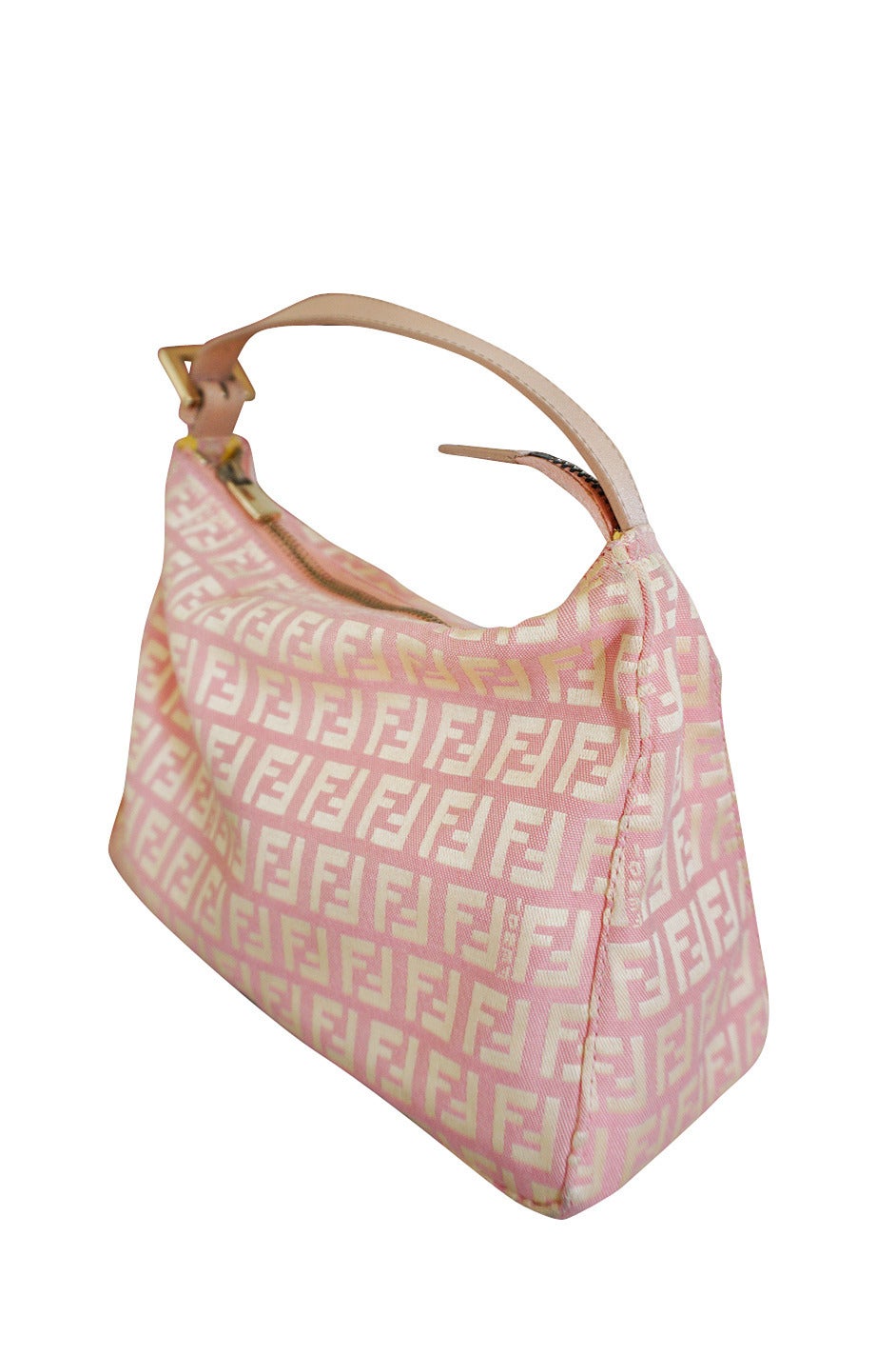 n a pretty shade of soft pink mixed with a gold toned thread woven to make the iconic Fendi logo, the exterior of this bag is instantly recognizable as being from the house of Fendi. Made of a beautiful light woven silk, this pretty little pouchette