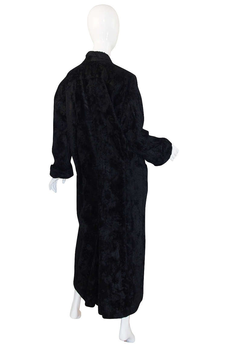 Fabulous Norma Kamali OMO Tuxedo coat with a double breasted front slung low to emphasize that amazing wide shoulders and skinny bottom silhouette. It's like a play between a retro men's evening coat and some crazy bathrobe! Its actually quite light