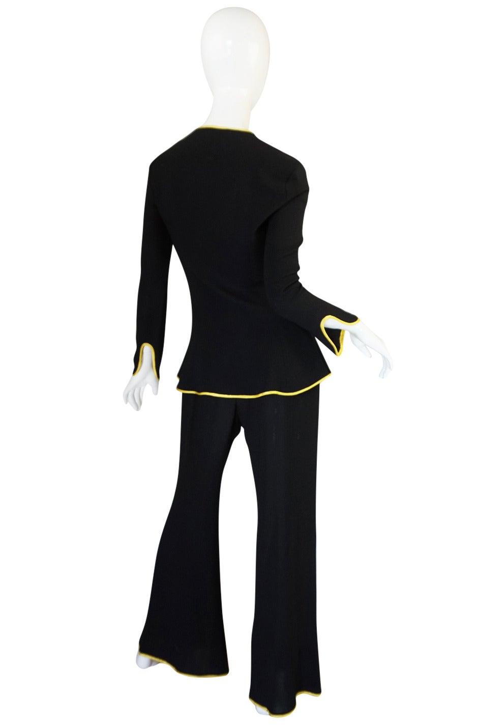 This is a classic design from Ossie Clark and I am pleased to have two versions of this land in the shop - this one with a yellow trim and a second with a green trim. I love the subtle sexiness of the suit - the 