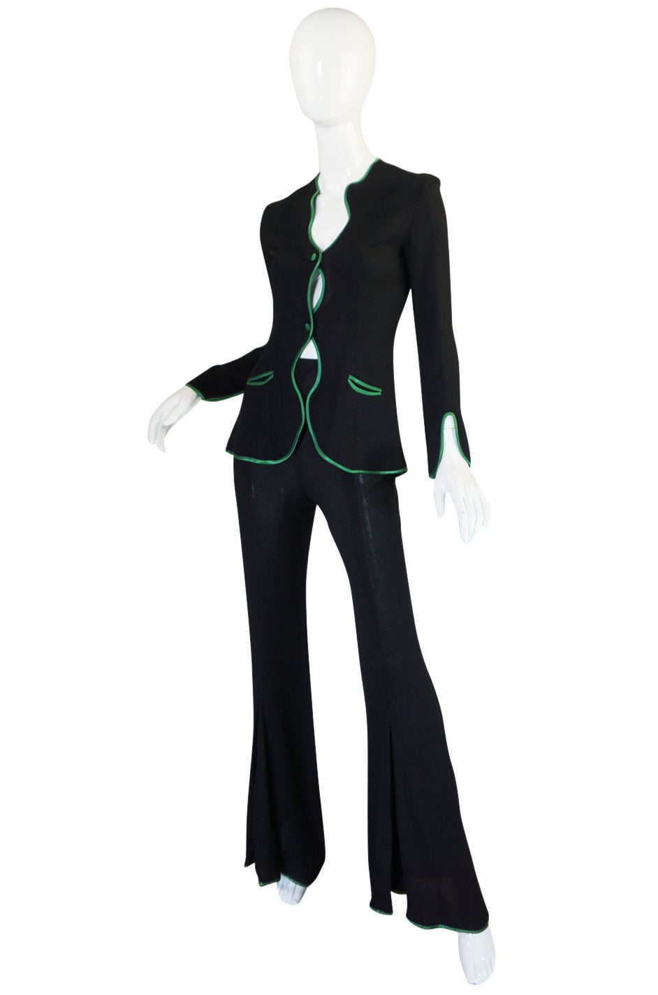 This is a classic design from Ossie Clark and I am pleased to have two versions of this land in the shop - this one with a green trim and a second with a yellow trim. I love the subtle sexiness of the suit - the 