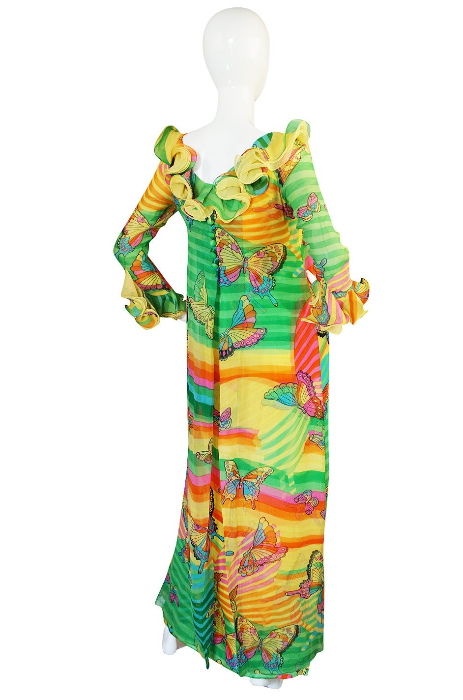 This bold and dramatic silk chiffon dress is instantly recognizable as a Hanae Mori piece. Her signature butterflies flit over its surface in an exuberant explosion of color. I absolutely love the bright color palette and find the boldness of it to