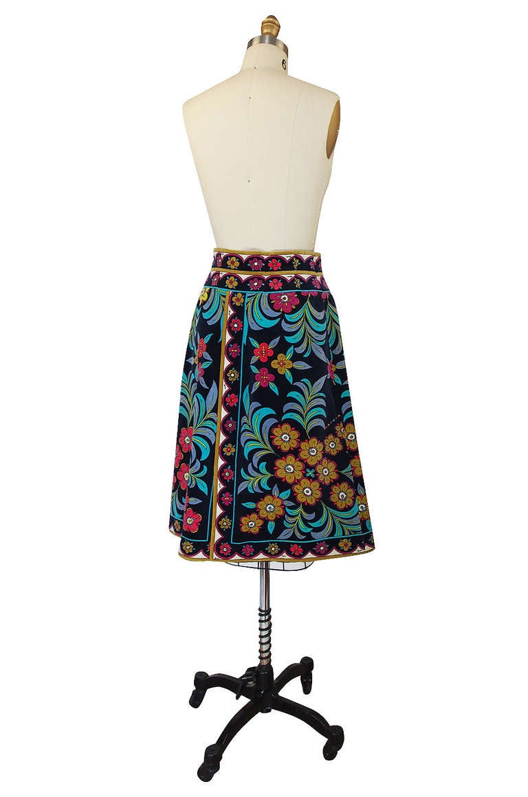 Gorgeous cotton velvet skirt by the Emilio Pucci! in a beautiful mix of vibrant colors. A black velvet base has a dense design that covers the entire surface of the skirt. The edge of the hem is printed with a contrasting deign - making it instantly