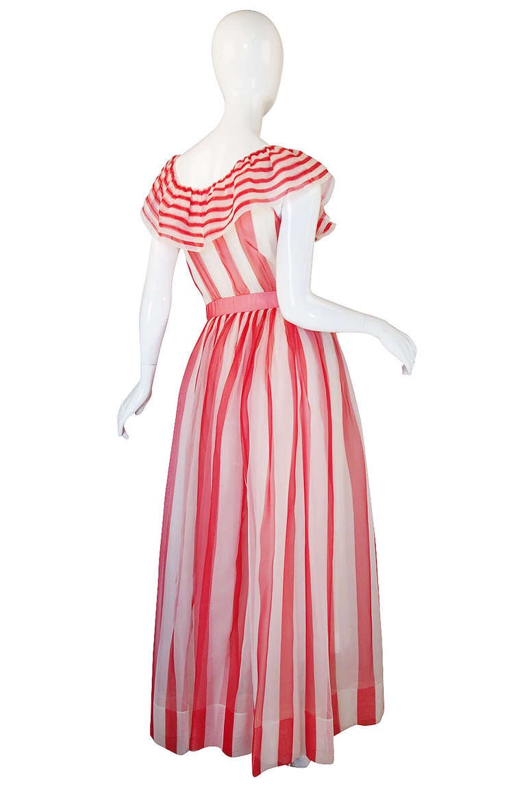 Incredible Christian Dior gown in a beautiful silk chiffon that has been done in a red and white striping. To me this is the perfect summer gown - it has a light and airy feel to it, the front plunge feels sexy but not overtly so and the color is