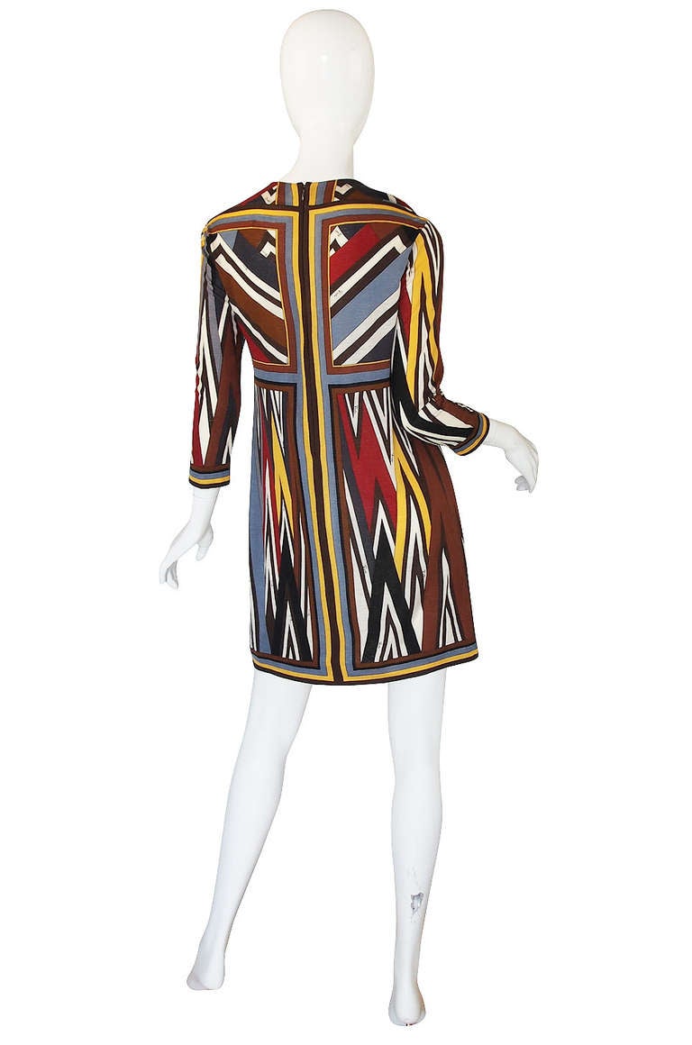 An absolutely gorgeous Pucci dress that is so comfortable and cosy to wear because it is made of soft, lightweight cashmere and silk mix fabric. It has a custom screened design that features one of his iconic angled prints. Skinny sleeves and a