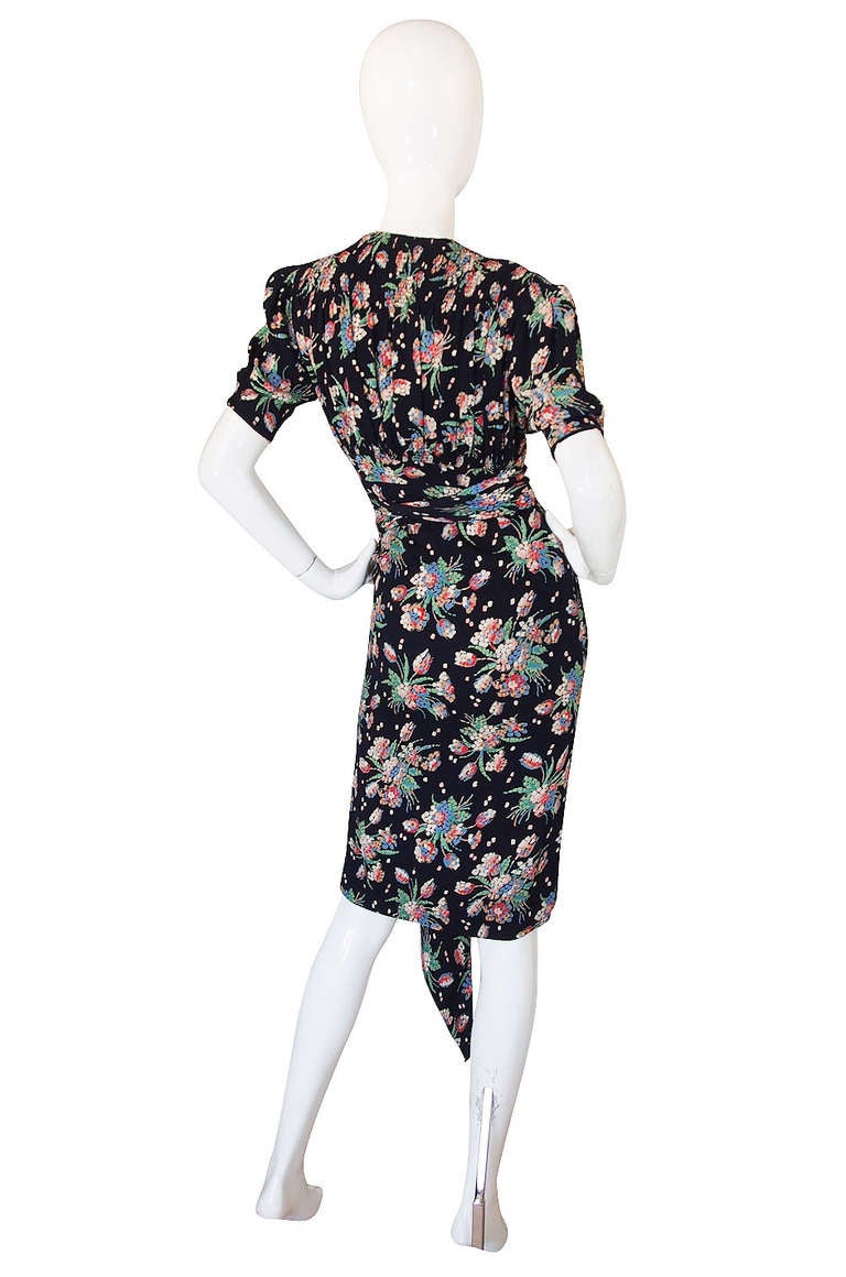 Made from an amazing printed stretch silk crepe that is cut on the bias so has a touch of stretch to it, this dress is one of the best 1940s dresses I have seen. It is tagged as a 