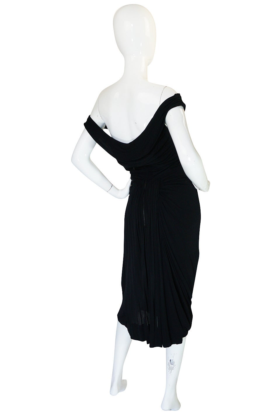 The early little black jersey dresses that Ceil Chapman made on the late 40s and early 50s are some of the best examples of her work out there. This piece is seriously fabulous and quite sexy and I hope that girl that decides to make it hers truly