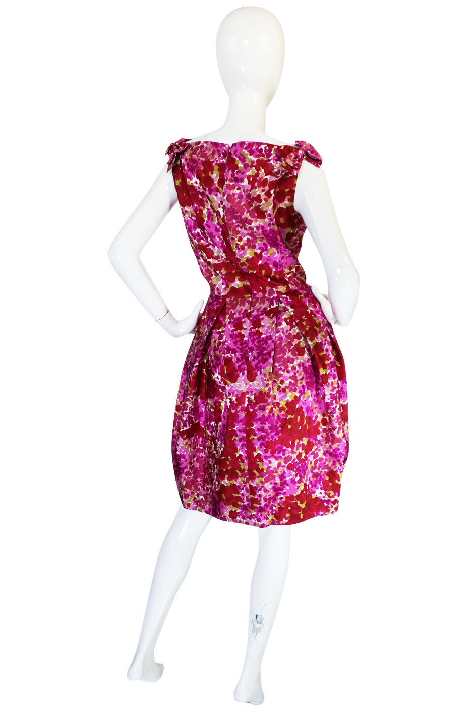 From the Dior Boutique collection comes this gorgeous little silk dress in a beautiful floral pattern made of shades of pink screened onto a lovely silk taffeta. I believe this is from the Galliano era and is a wonderful example of how he could be