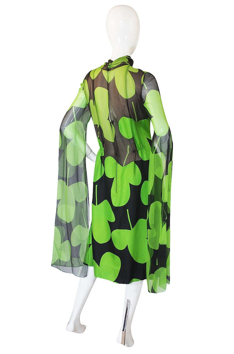Pauline Trigere's 1971 collection was nature -centric and featured turtle prints and other elements if that ilk. For this dress she used the clover as the base of the print and then blew it up so that it becomes an almost stylized element on its