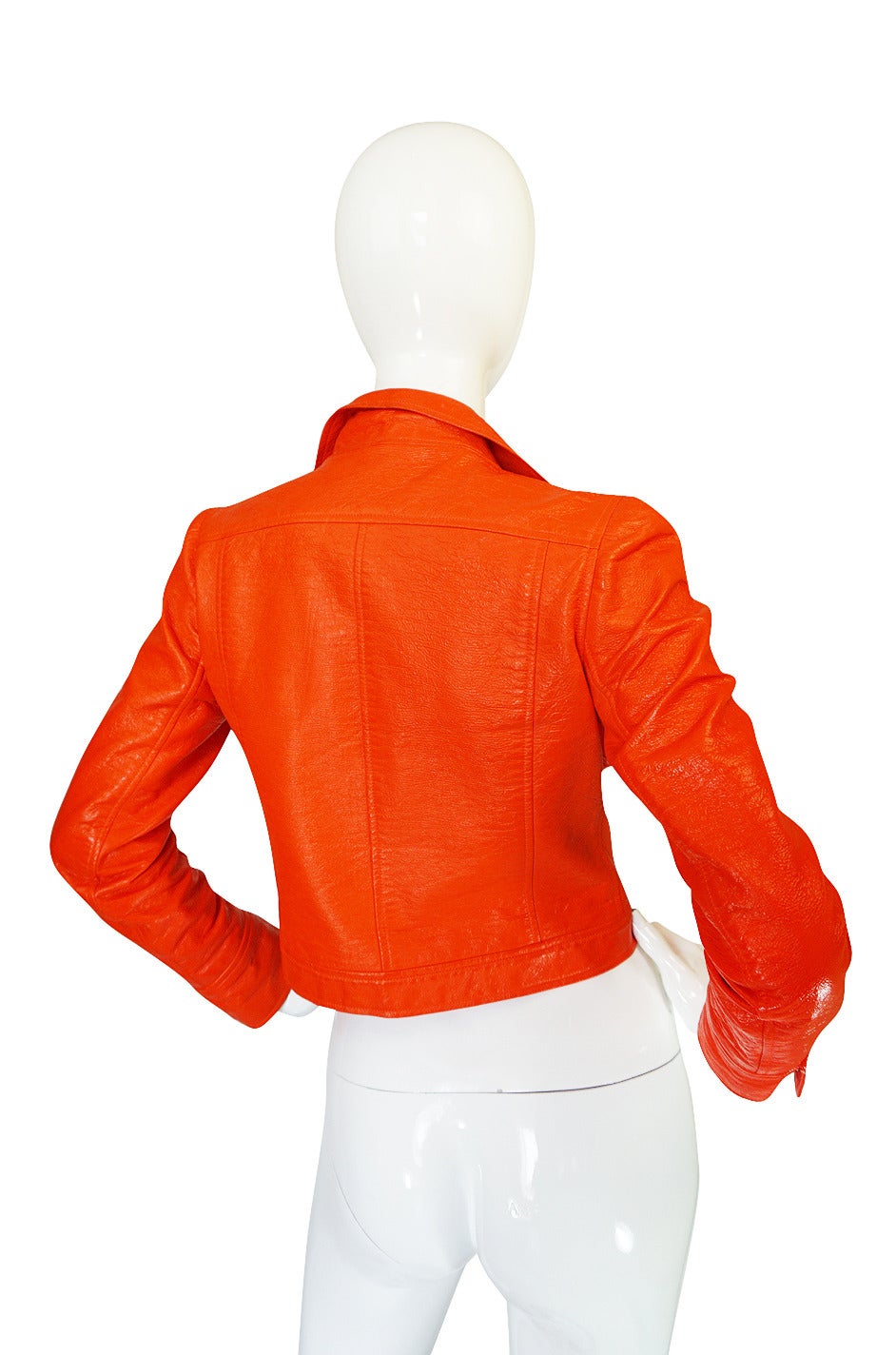 Courreges did these amazing little faux leather jackets made from vinyl in the 1960s and then the company re-issued them in the early 80s. This is one of the much rarer originals in one of the best and most coveted of the colors - the brilliant
