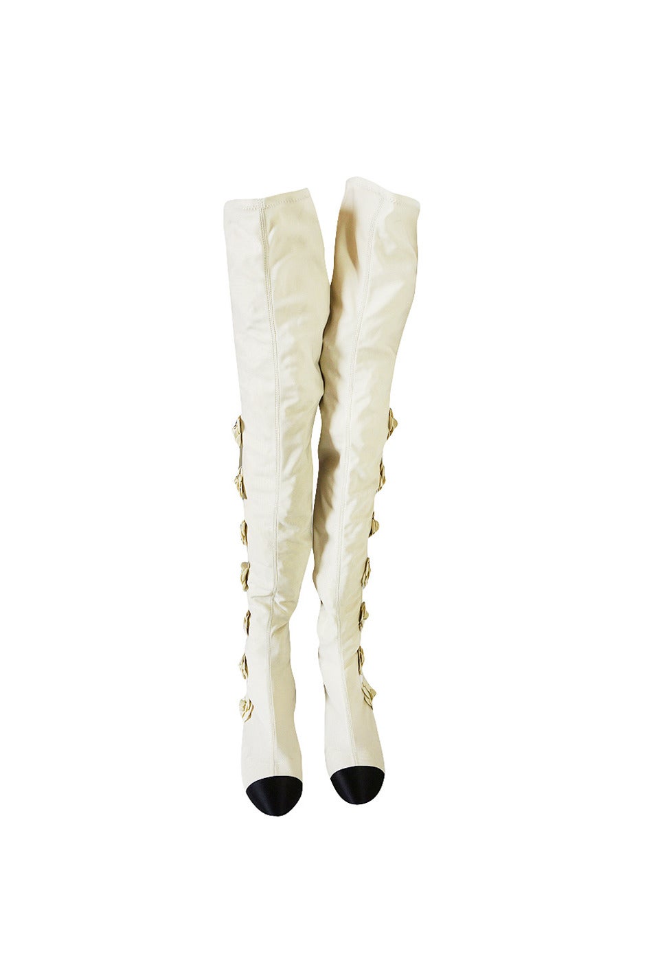 From the Resort 2011 runway these are one of the most coveted and hard to find Chanel thigh high boots out there. They are quintessentially Chanel. They are flat with the very minimal amount of heel and a black toe cap. Made of a stretch fabric in