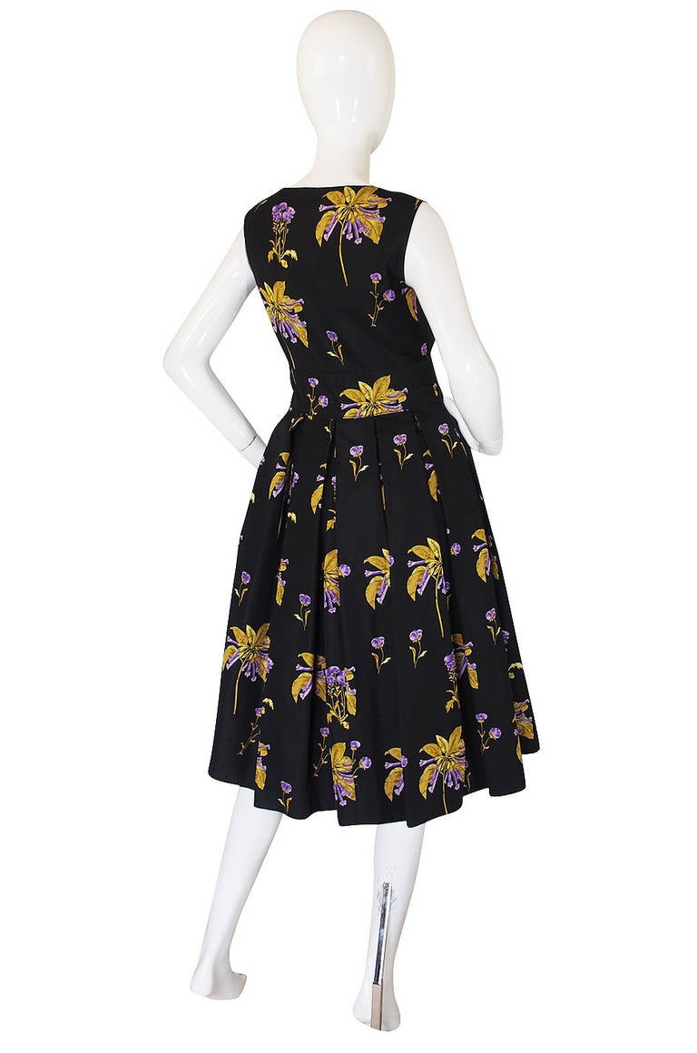 I love this amazing silk floral Prada dress from the 2008 Resort collection. This was one of the most famous of all Miuccia's collections and the pieces sold out world-wide shortly after being released. Being resort the pieces were produced in