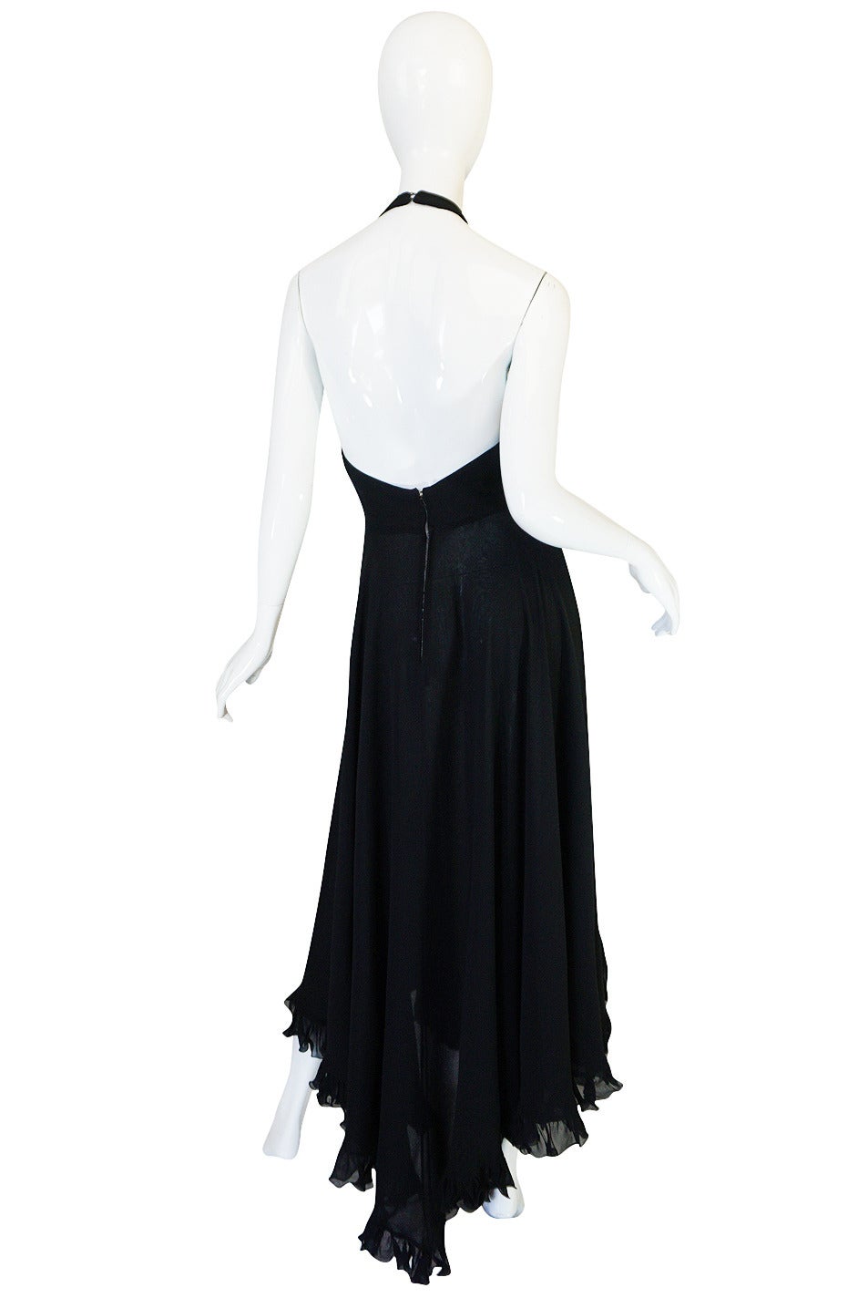 This dress is so sexy and really a phenomenal little black dress. It is made of a beautiful light silk chiffon that gives it tremendous movement and lightness. The  skirt is made of yards and yards of chiffon, cut on the bias and finished with a