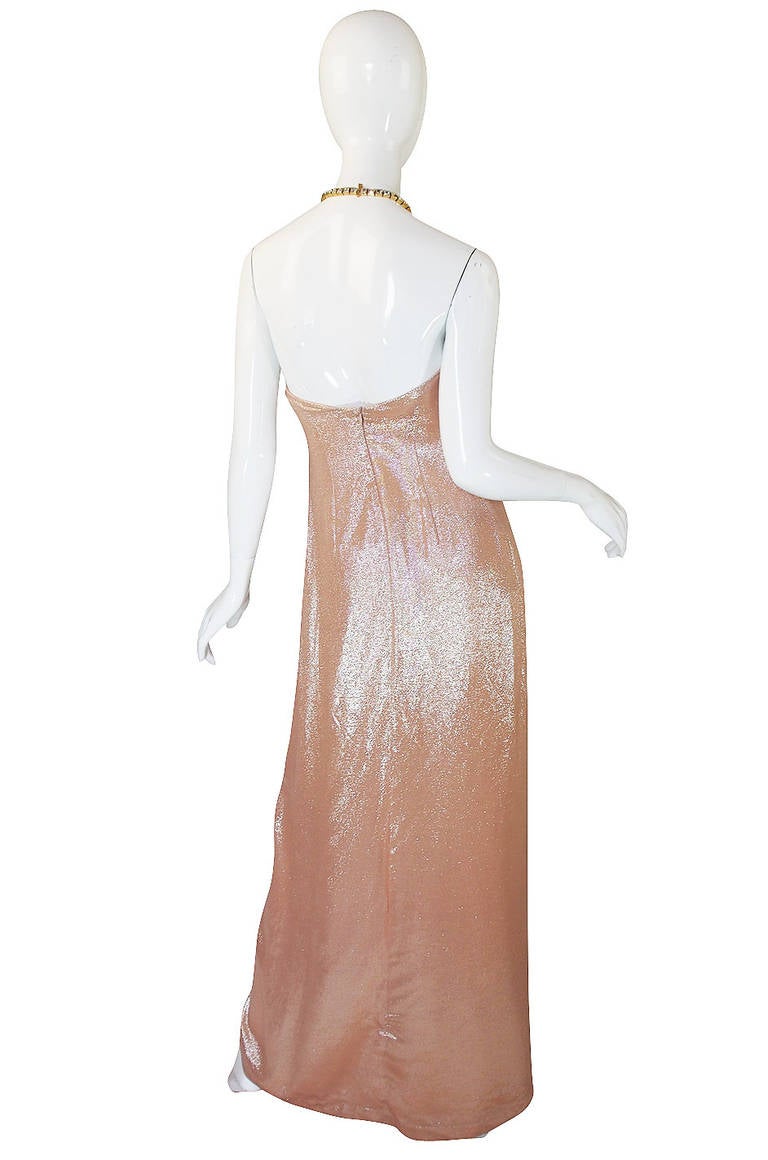 The fabric is what marks this gown apart and Mugler's choice of a dusty pink, bias cut lame is perfect. It has enough weight so his intended drape down the front hold perfectly when you move. The light catches it in different ways so you shimmer and