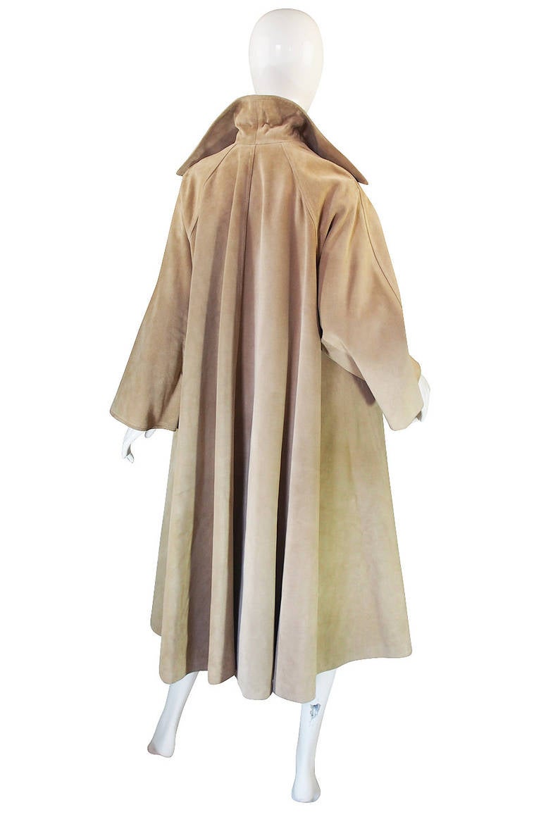 Love this seventies suede Dior coat with its incredible swing cut. You can just see the mastery in the cut with that incredible back especially - there is literally yards of fabric in it and yet is falls in those beautiful soft rounded pleats with