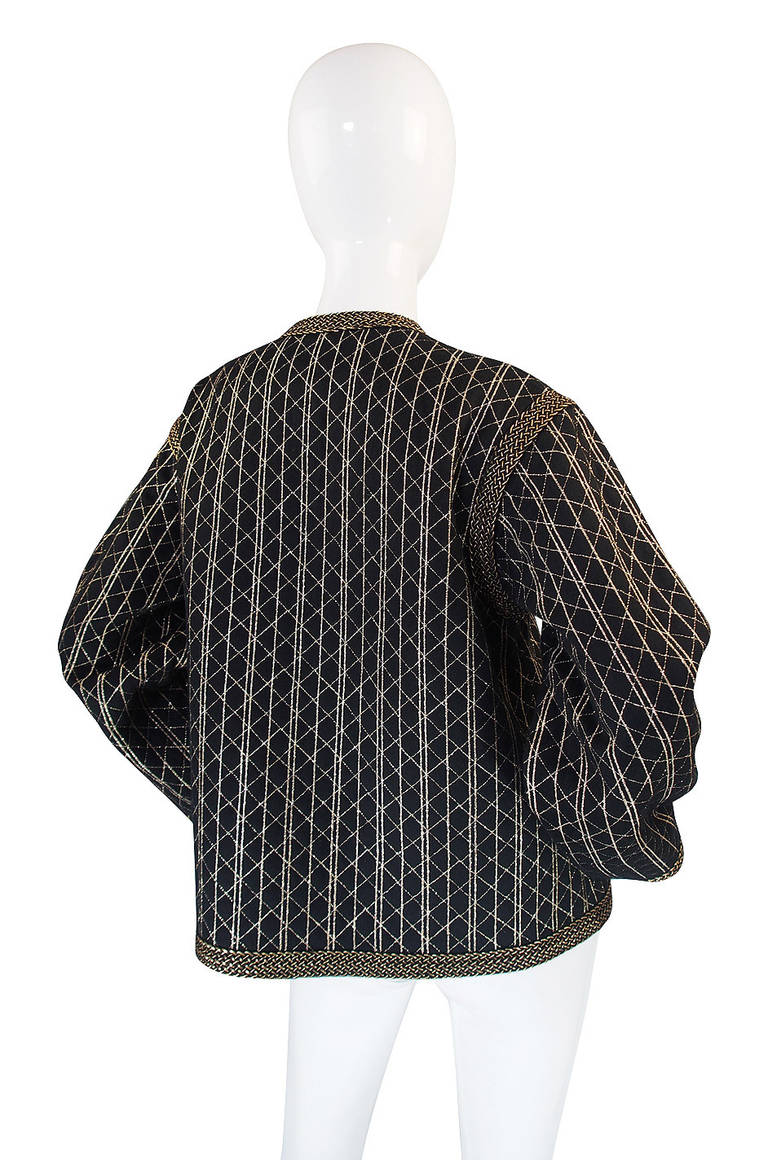 This jacket is just wonderful! It is an incredible combination of a fine metallic gold thread and gold cording on a soft, light, black felted wool. The cut is a comfortable to wear box cut that is chic but loose and easy - classic Yves. The sleeves