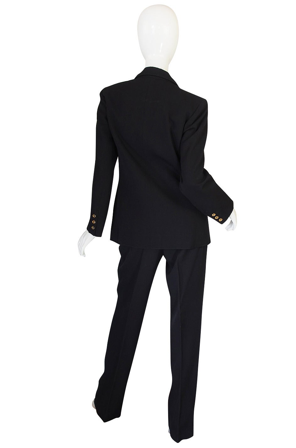 This suit bears one of the early Saint Laurent Rive gauche labels and also has a hand written tag ion the pants - most likely denoting it as a custom order. Something appropriate for those early years of the boutiques opening. It is classic Yves