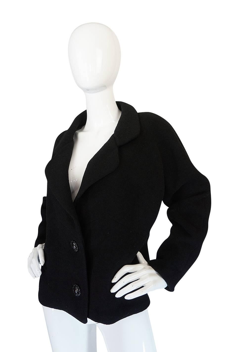 

You can never go wrong with a perfectly made little black jacket and this stupendous Haute Coutre Balenciaga example is perhaps the epitome of that statement. Balenciaga has gone down in history as being one of the great Masters of couture and