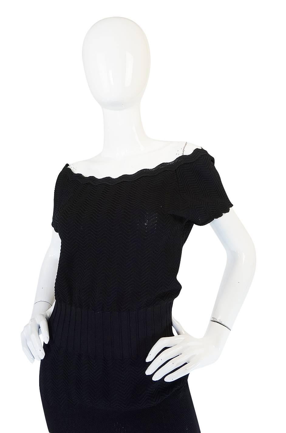 

This little black knit dress from the 2008A collection that Karl Lagerfeld designed for Chanel will quickly become one of your favorite pieces. It is the kind of dress that works on its own, layered under other pieces and can easily transition