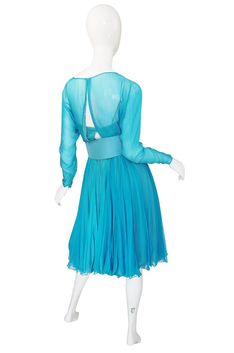 The construction on this 1960s Galanos dress is divine. It is made of layers of gossamer weight silk chiffon - a difficult fabric to work with under any circumstance. Galanos cut it on the bias, layered it and made it all work perfectly. Three