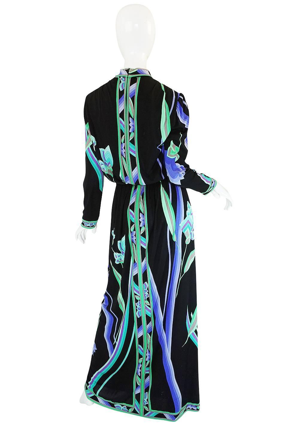 

Leonard Paris is a label that was a contemporary of Emilio Pucci but Leonard dresses tend to be a touch softer and more draped versions of the Pucci look for the most part. This one is a stunning example of that and a delicious combination of