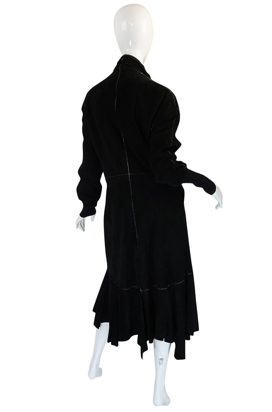 

This coat is just spectacular - the suede used is so light and butter sift that you could almost get away with wearing this as a dress. It certainly has the lines and styling of one. It is a wrap coat and I love that the ties are a contrasting