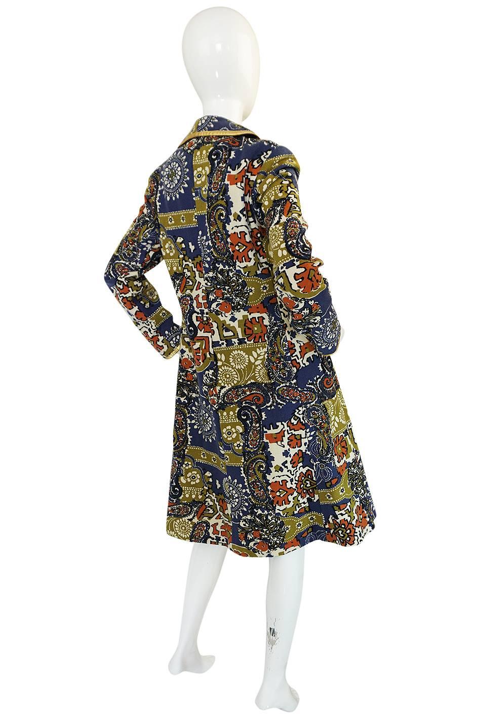 A year or so ago I had the dress that matches this coat and I am sad that I did not find the two at the same time. Regardless of that this is an absolutely gorgeous Malcolm Starr coat with superb detailing. It is made of a felted wool with a