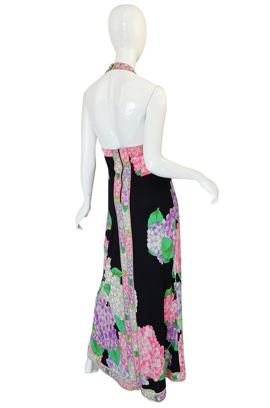 

This fabulous and sexy 1970s Leonard maxi dress is a find. It is made from his signature silk jersey fabric and this choice of fabric gave these long maxi length dresses the perfect drape and fit. It is that perfect balance of being easy to wear