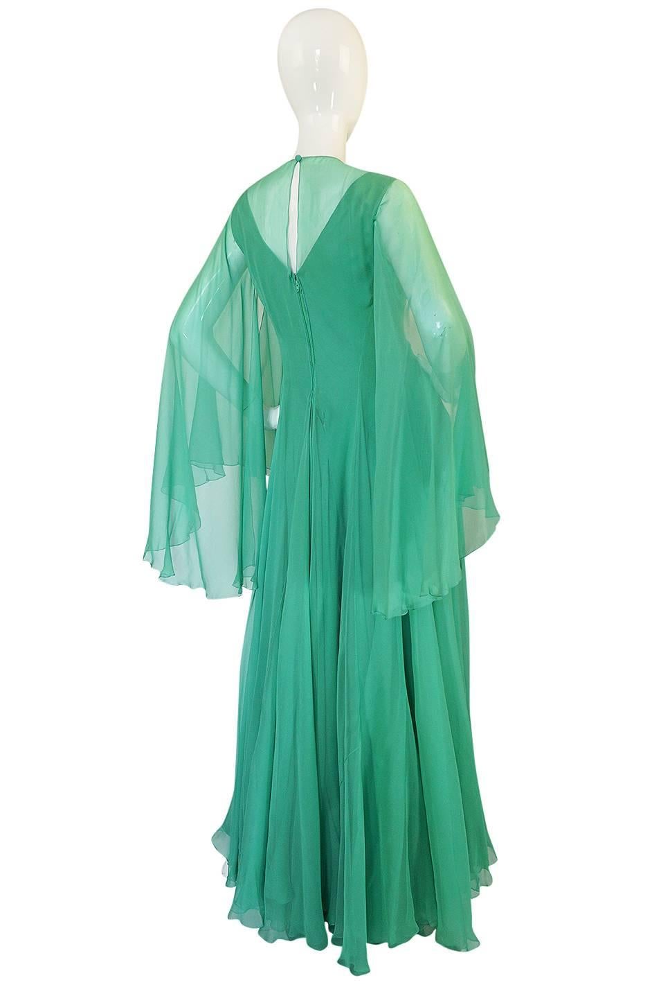 This stunning dress is one of the most incredible Stavropoulos gowns I have had in the shop. I love the lightness and airiness of it that created by the layers and layers of the mint green silk chiffon. In person, the layers give it a depth not