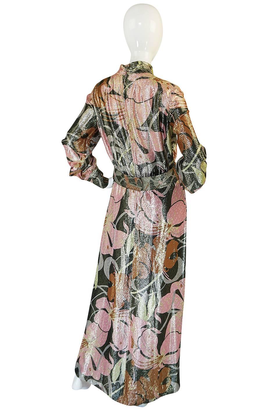 

The color and fabric on this dress is quite amazing - it is a light metallic lurex that has a gold overlay on top of a fabulous mod feeling pink toned print that I love. The pattern that is worked onto the base fabric covers the entire surface