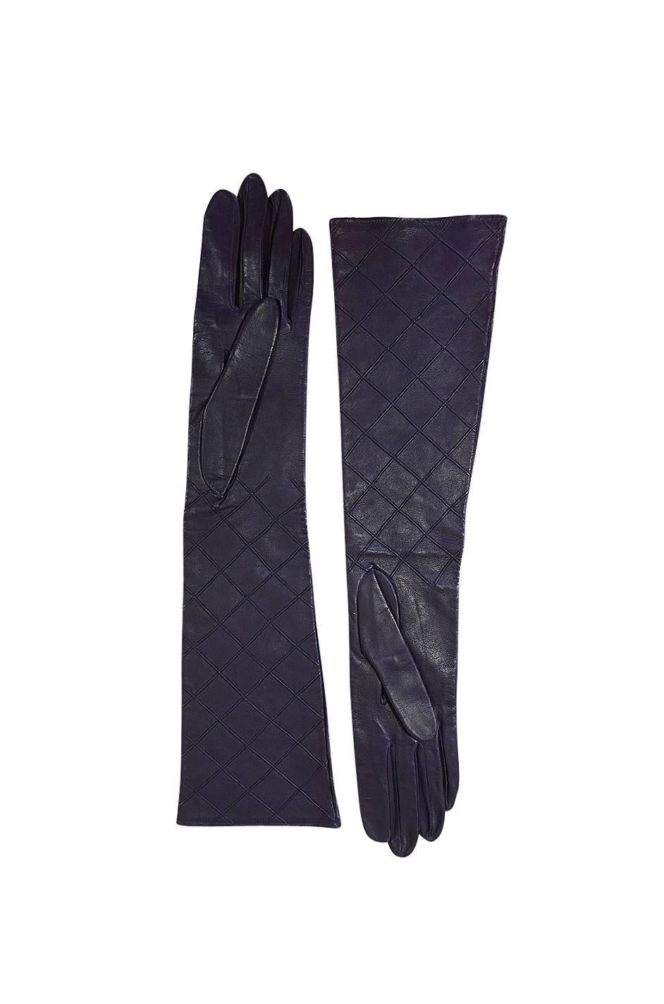 

Wonderful Chanel gloves that sit right to the elbow and that are made from the finest lightest kid leather that has been hand dyed to a beautiful purple color. They are lightly lined which allows them to perfectly mold to your hand and be